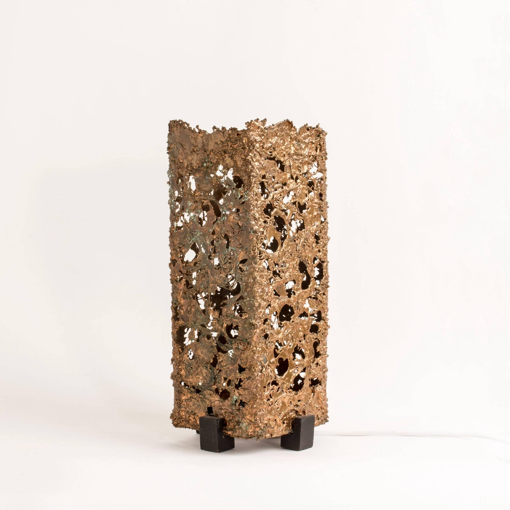 Very cool copper table lamp, made in Sweden in the 1960s in a Brutalist design. The body of the lamp is made with shards of copper that let some light slip through the gaps between them.