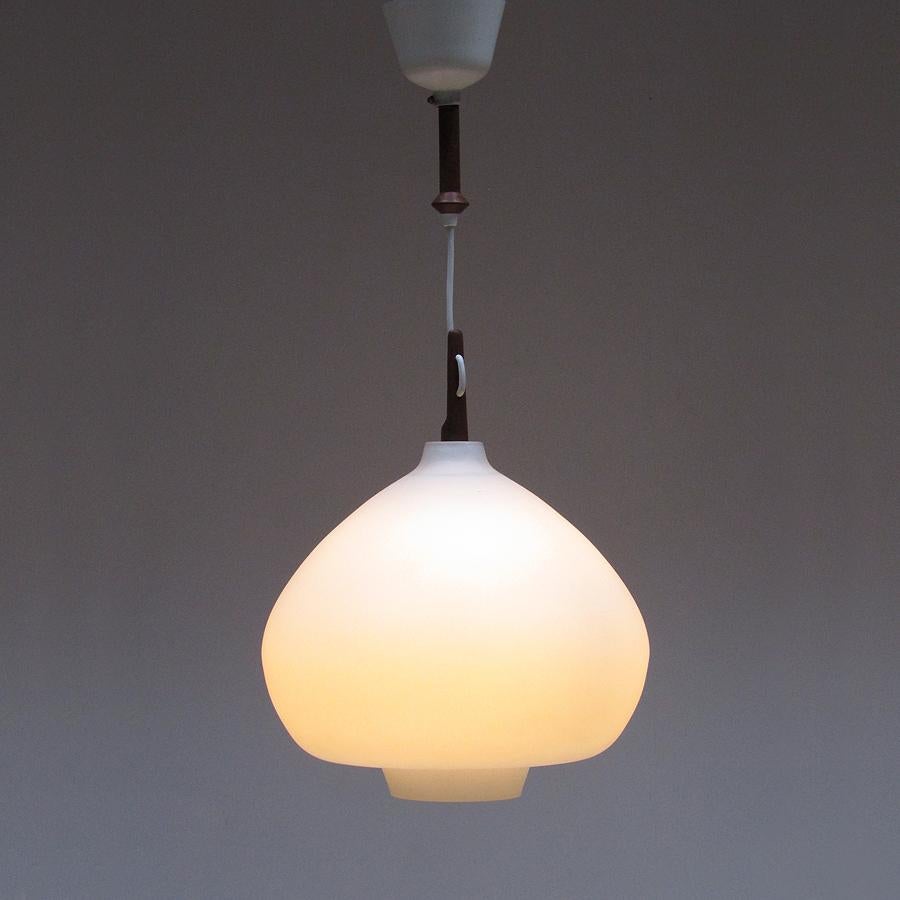 A beautiful Swedish teardrop ceiling pendant by Hans-Agne Jakobsson for Markaryd.

Dating from the 1960s, the thick cased glass casts a beautiful diffused light. The long cord allows a drop of up to 140cm. The diameter of the shade is 34cm (13.5