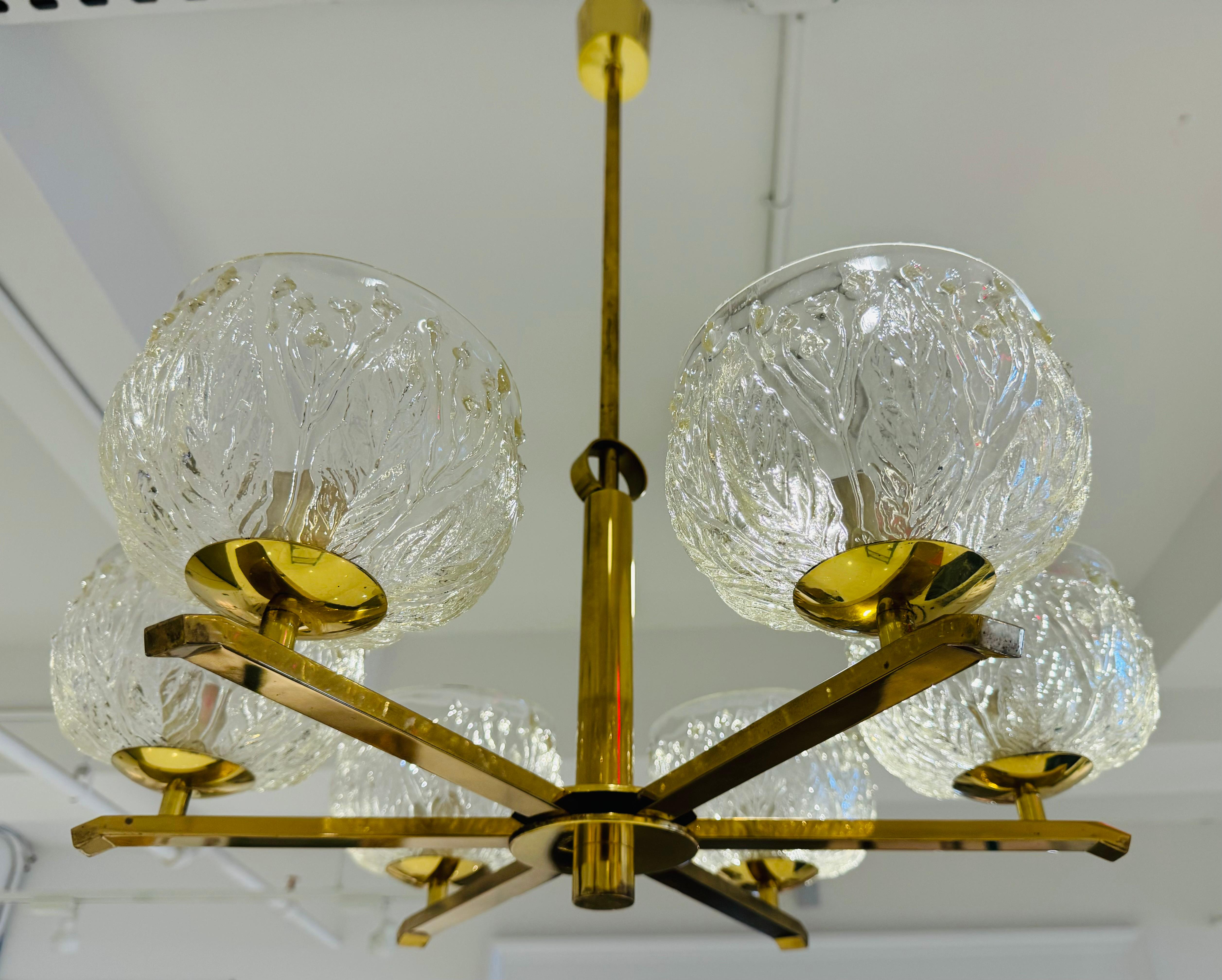 A rare 1970s Swedish six light polished brass pendant with floral molded glass shades. Rewired. 