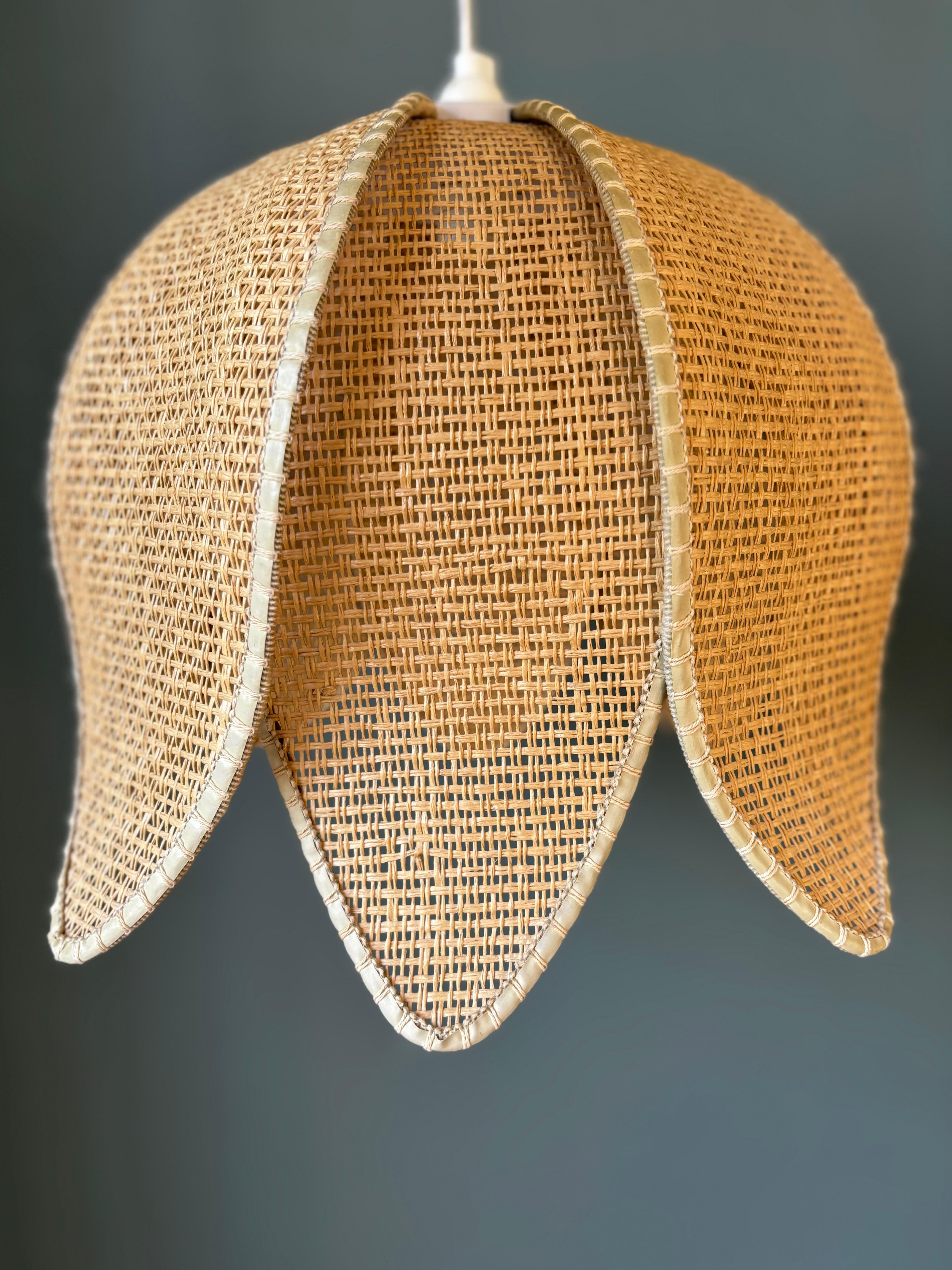 Set of two handmade flower shaped organic modern braided natural warm light brown rattan pendant. Eight layered sides with beige colored edges and matching light brown thread to form a soft organic modern shape. New wiring and white fitting for E27