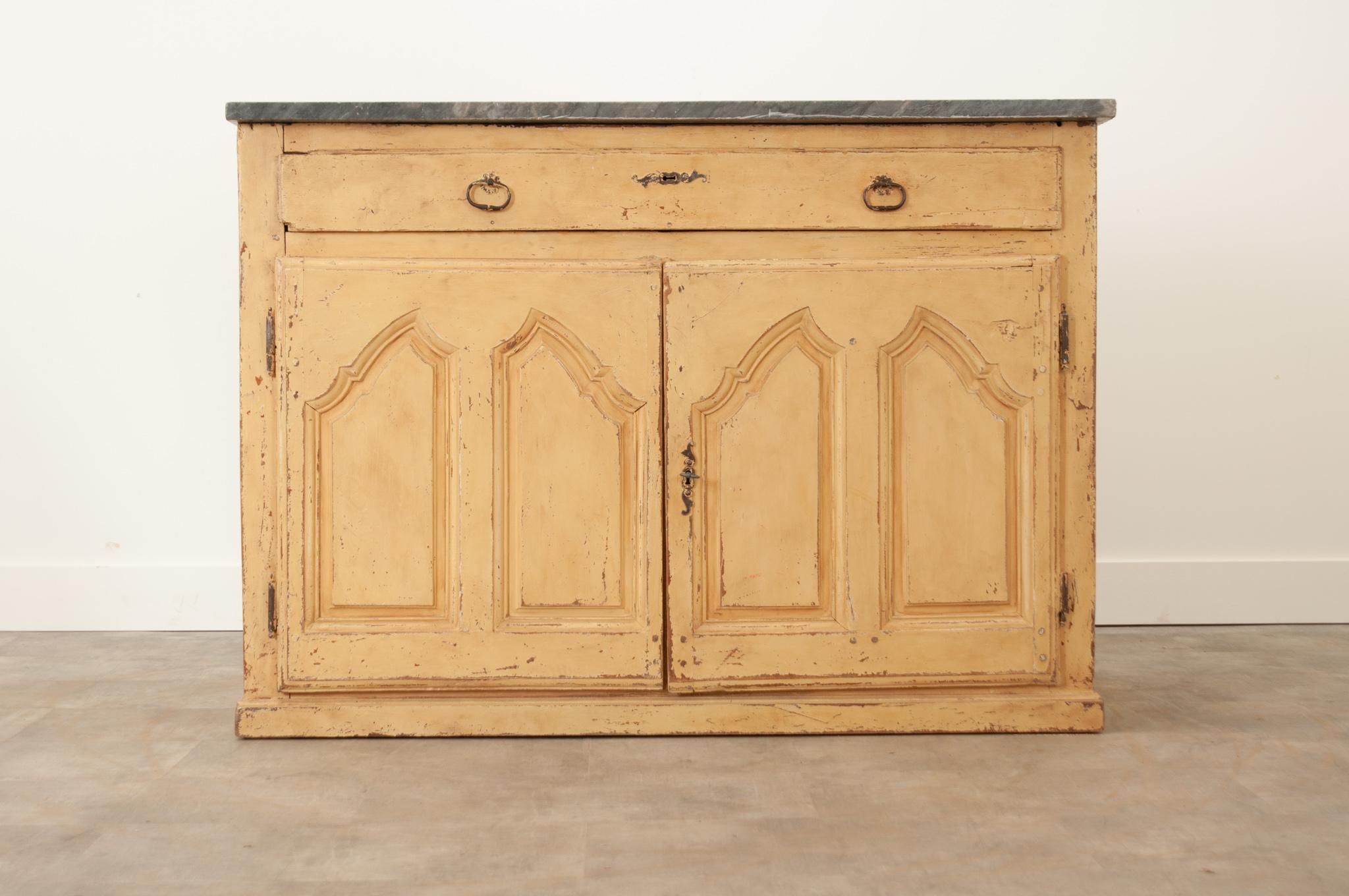 This fantastic Swedish bakers cabinet is a versatile addition to any space. Crafted in the 19th century with the original, worn charcoal marble top. The apron houses a single lengthwise drawer with a pair of oval bail pulls. Unlocking the shaped