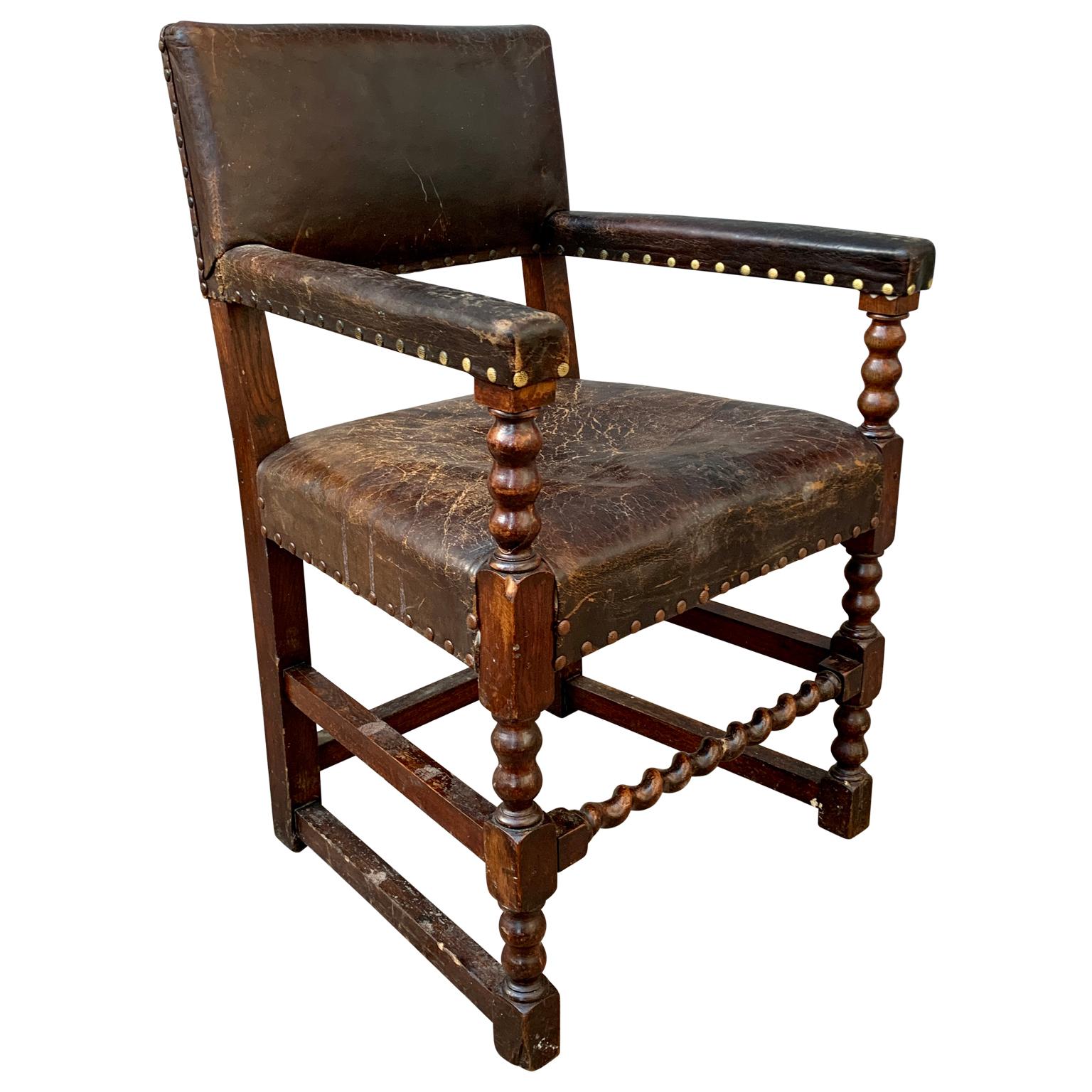 A 19th Century Baroque armchair with original leather clothing from Sweden in dark wood.

 