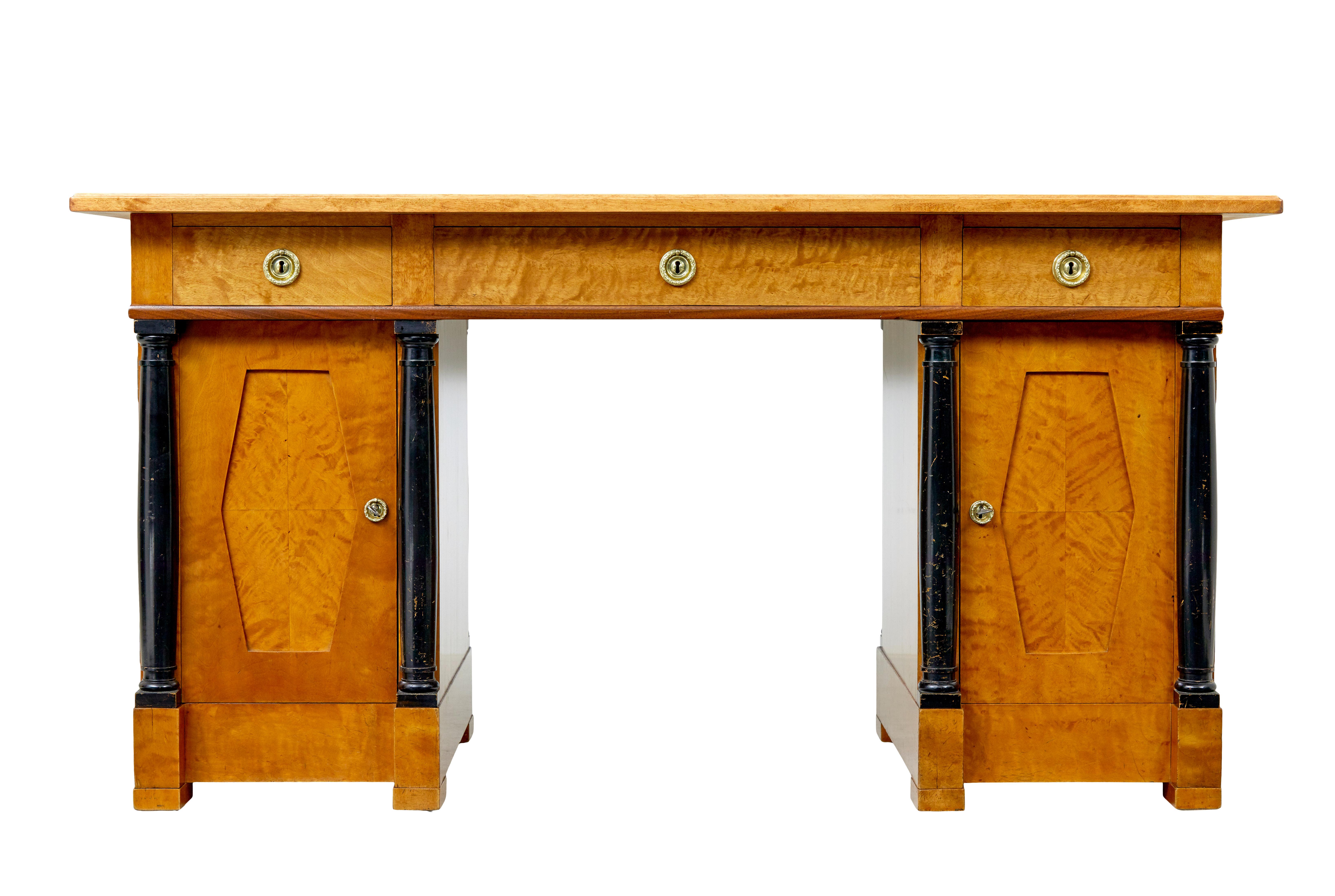 Swedish 19th century carved birch pedestal desk circa 1890.

Good quality empire revival Swedish 3 part desk, comprising of 2 pedestals and a writing surface with drawers.

Quarter veneered top surface with an inlaid contrasting walnut border, 3