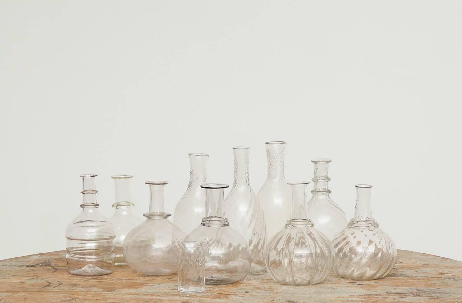 Swedish 19th century handblown turned glass carafe, origin: Sweden.

We adore these sculptural, pure, handblown glass carafes. Great objects on their own and/or added to any table setting used for wine, waters and flowers. Can never have enough of