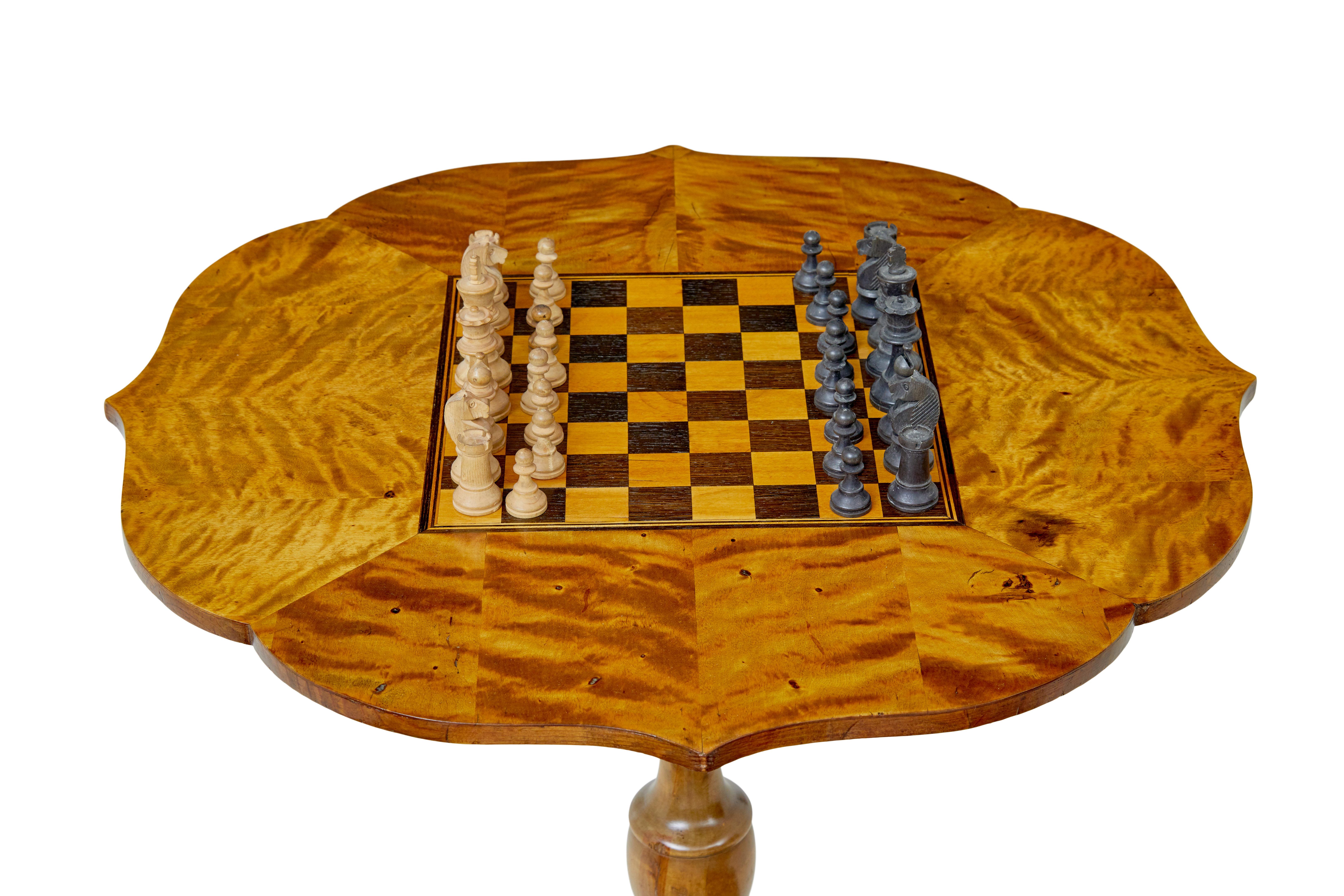 Scandinavian 19th century inlaid birch games table circa 1880.

Fine quality games table ideal for chess. Scalloped shaped top with inlaid playing area in walnut and birch. Playing area of 25cm x 25cm. Supplied with a chess set which came with the