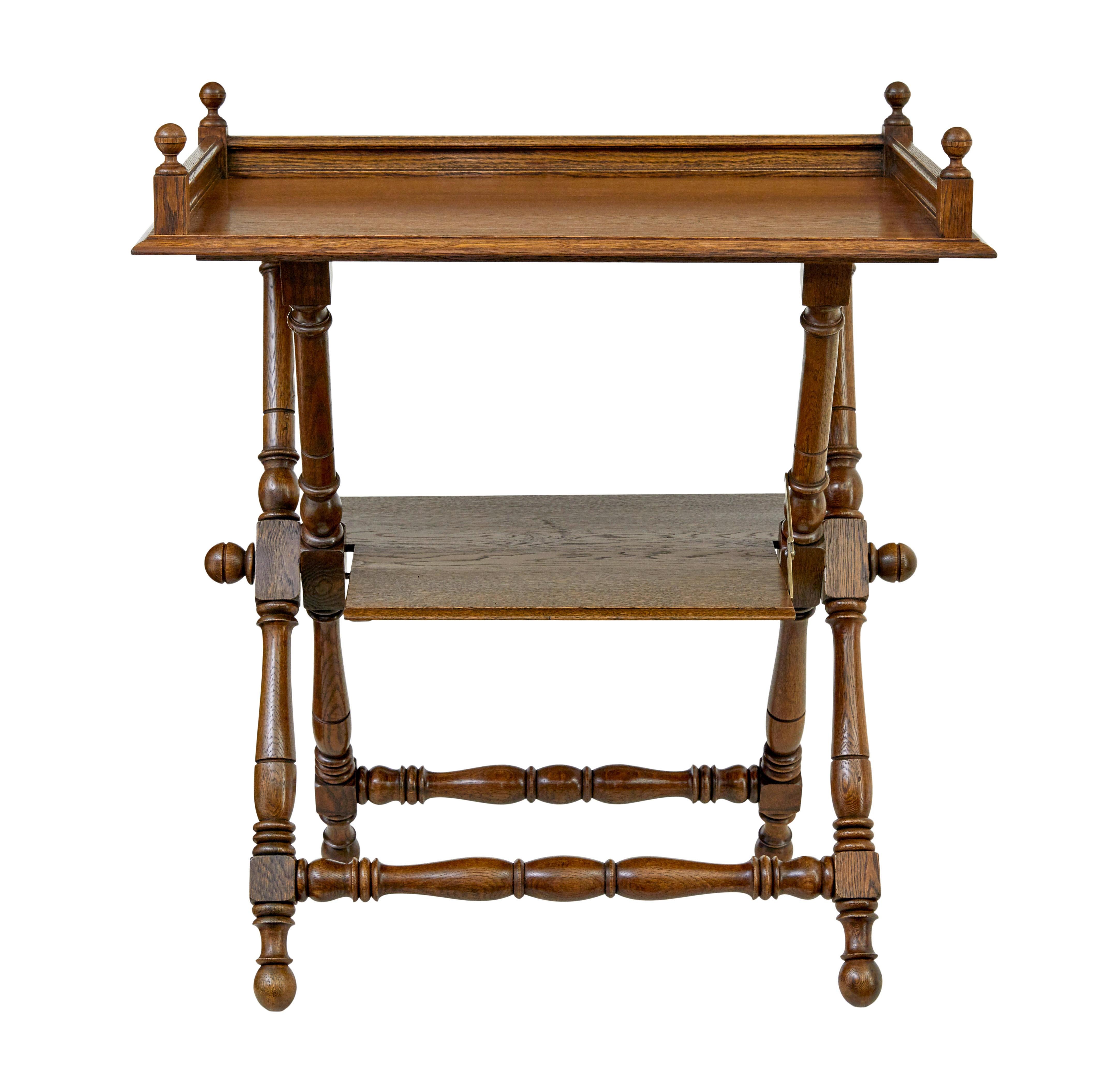 19th century oak butlers tray from Bäckaskog castle circa 1890

Fine quality butlers tray on stand from Bäckaskog castle in Sweden.  Removable tray with 3/4 moulded gallery and turned finials on each corner.  Stands on a turned base which unusually