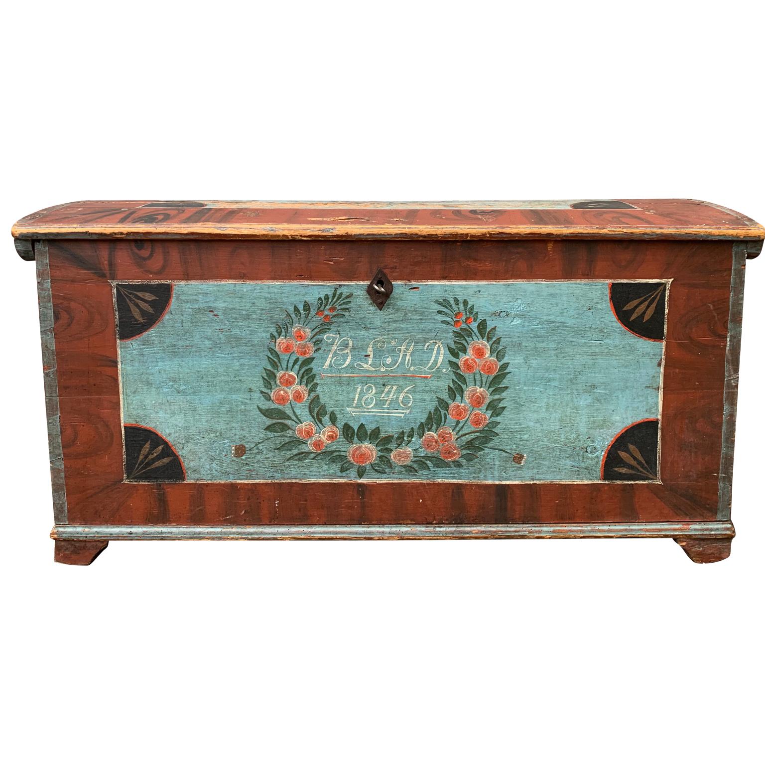 An original painted dome-top trunk from South Sweden, dated 1846. It has the initial of the father of the wife to be 