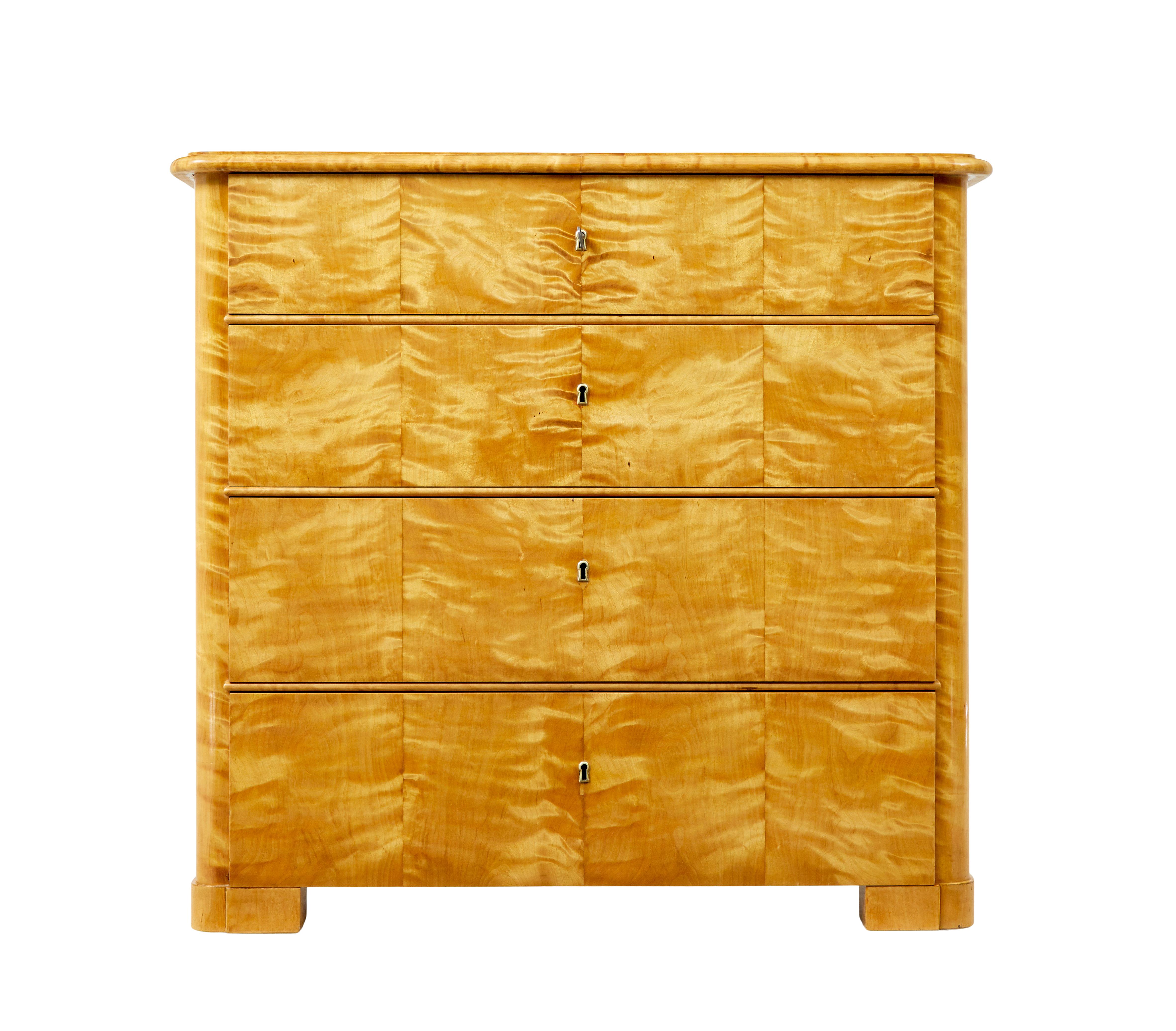 Scandinavian 19th century satin birch 4 drawer chest circa 1870.

Simple but elegant piece of Biedermeier influenced furniture. Rectangular top with moulded edge, below which a 4 graduating drawers each veneered in striking satin birch. Typically of