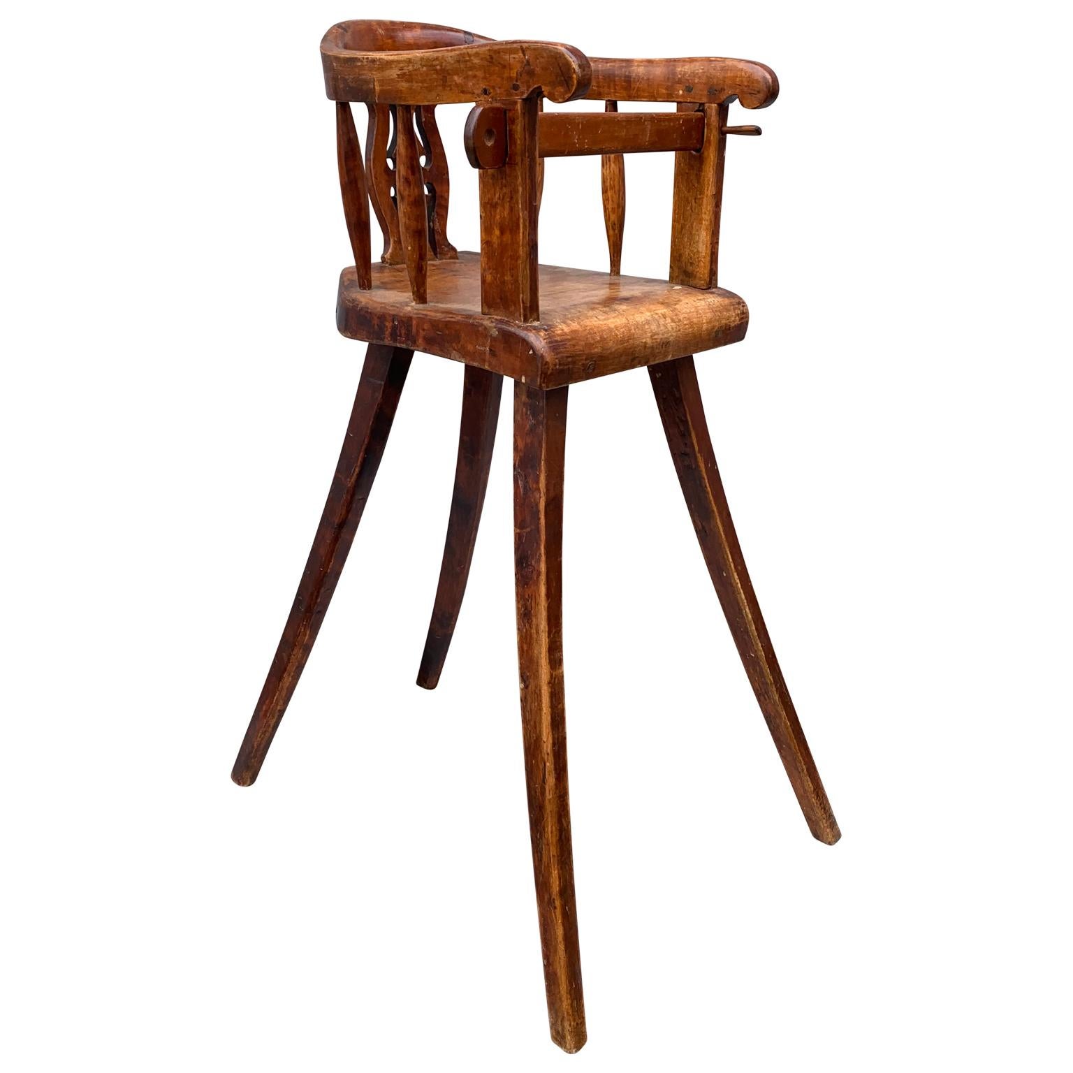 Swedish early 19th century wooden child's high chair.
 

   