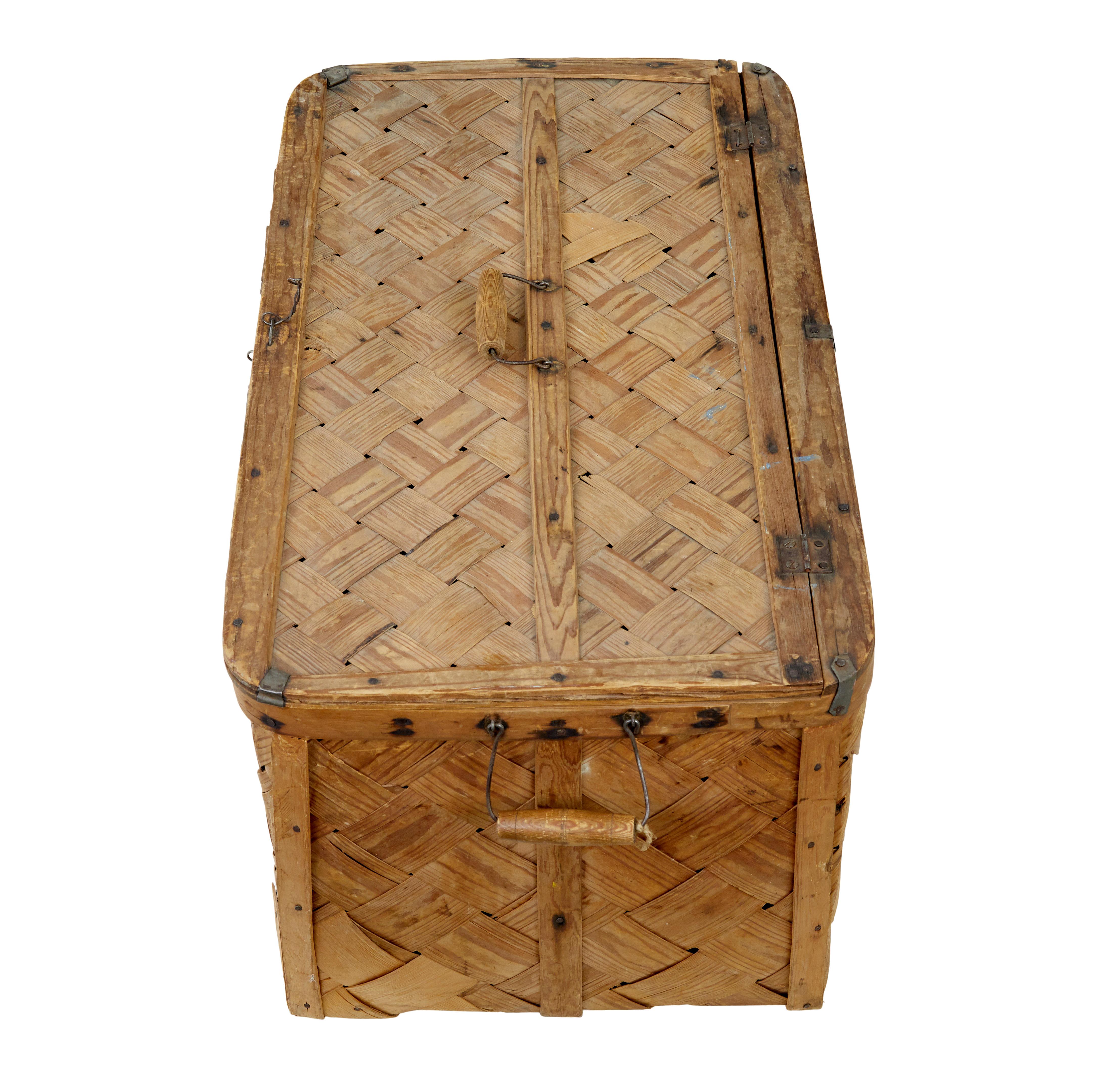 Swedish 19th century woven pine basket circa 1890.

Beautiful rustic made pine basket using strips of pine fixed into a pine frame. Complete with original lid.

Fitted with a handle each side and 1 to the lid. Ideal for its original use.

Very minor