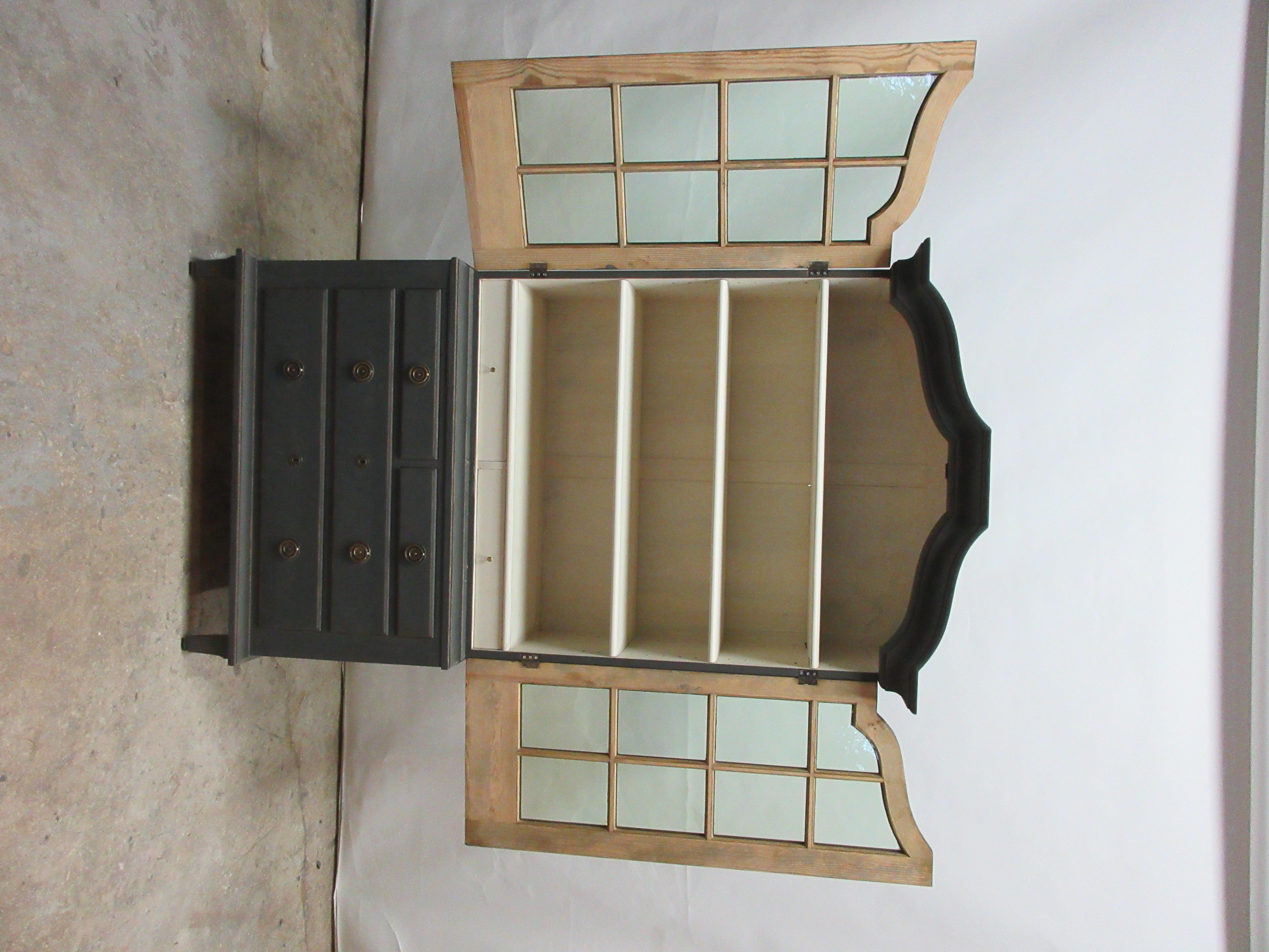This is a Swedish 2-door glass top hutch, it comes apart in 2 pieces and is very easy to move. It was found at a auction in Stockholm, Sweden.