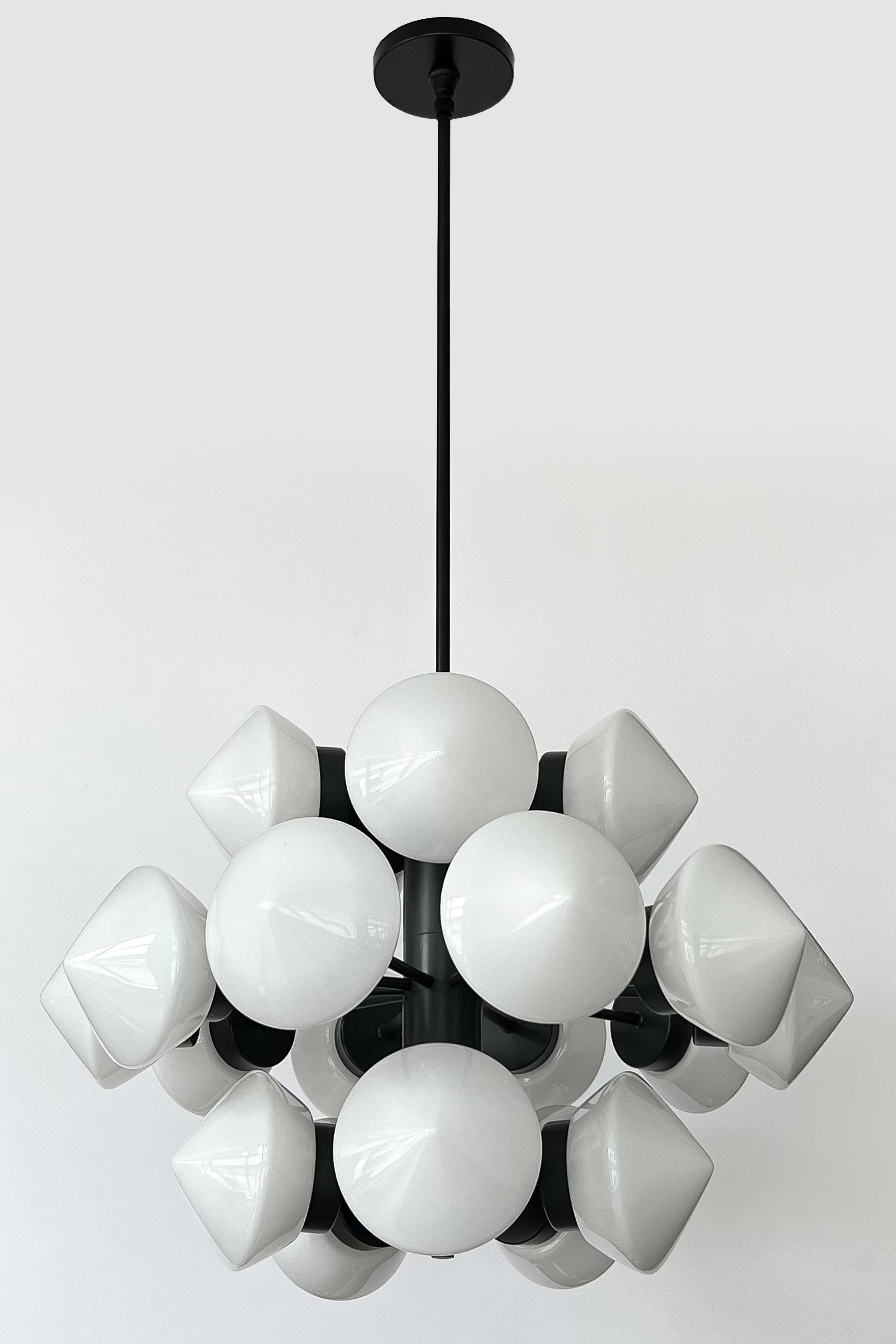 A captivating Swedish chandelier by Fagerhults Belysning, circa 1960s, that showcases the essence of Scandinavian Mid-Century Modern design. This striking large chandelier, measuring 43