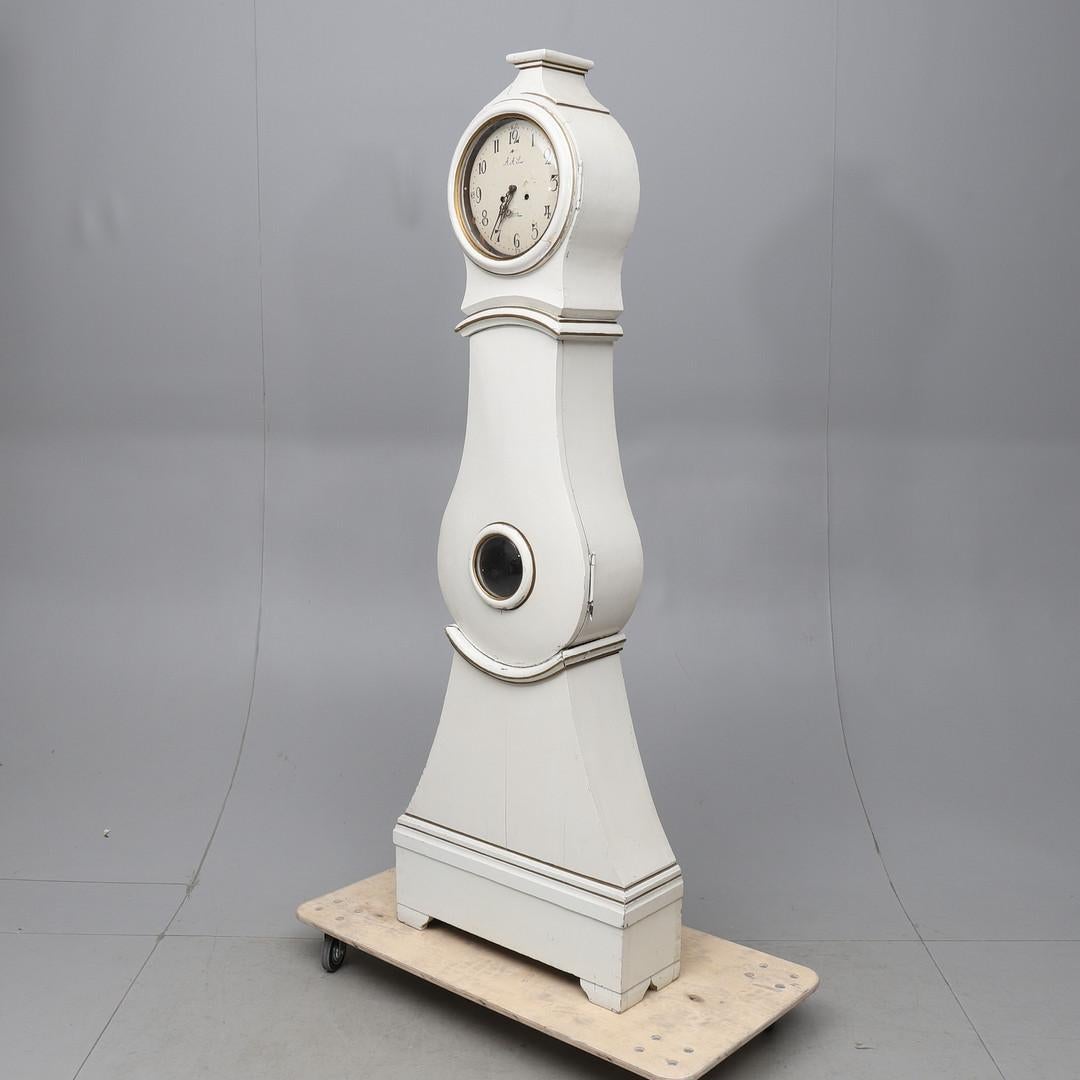 Lovely example of a very decorative early 1800s antique Swedish mora clock with nice detail and a slightly wider base at 71cm body. Measures: 208cm.

This original 1800s mora clock has a beautiful face with a clean patina and some enamel