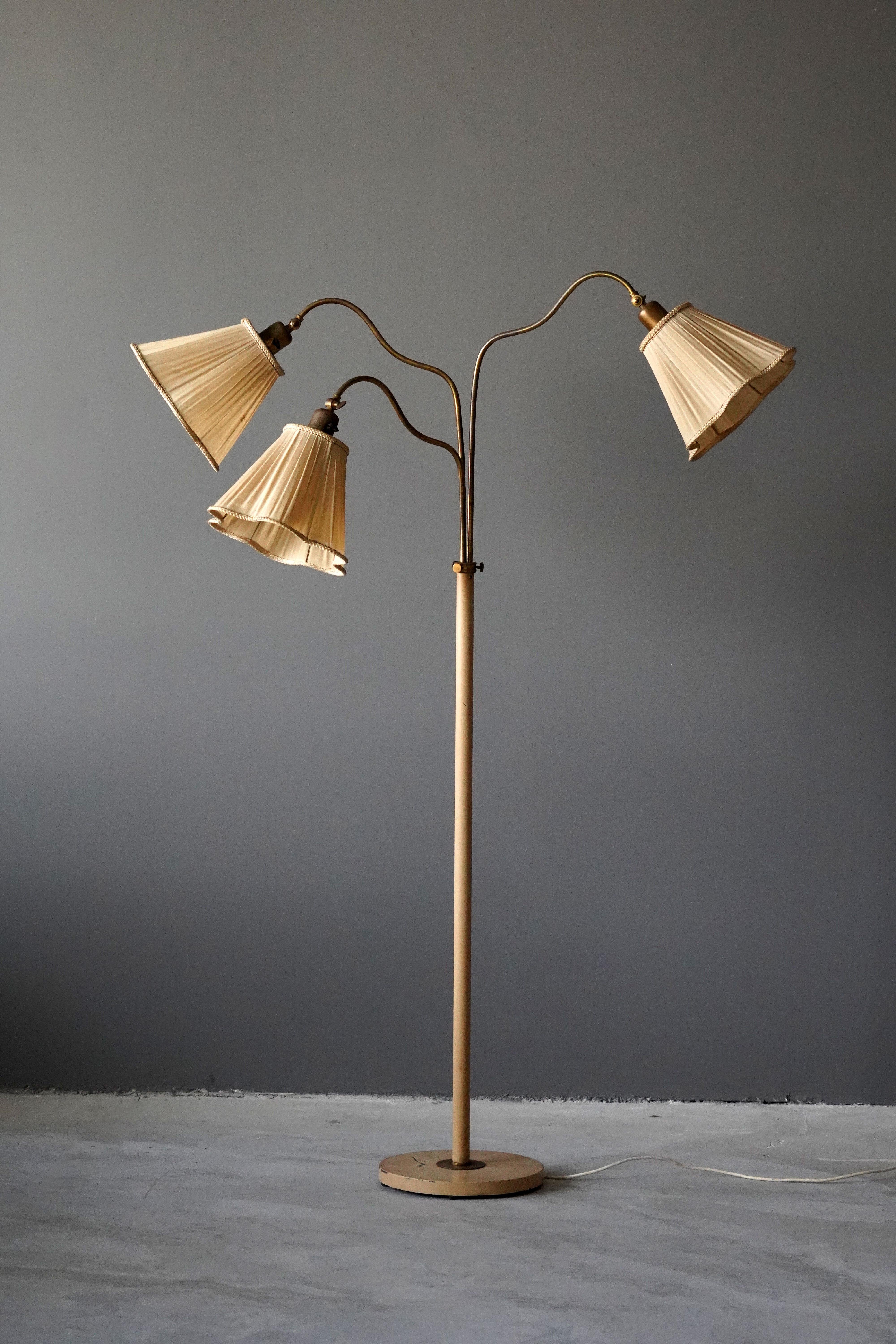 An adjustable three-armed functionalist floor lamp. With adjustable arms. Vintage lampshades. Original cream white paint. 

Dimensions variable. Stated measurements as illustrated.

Other designers of the period include Josef Frank, Paavo