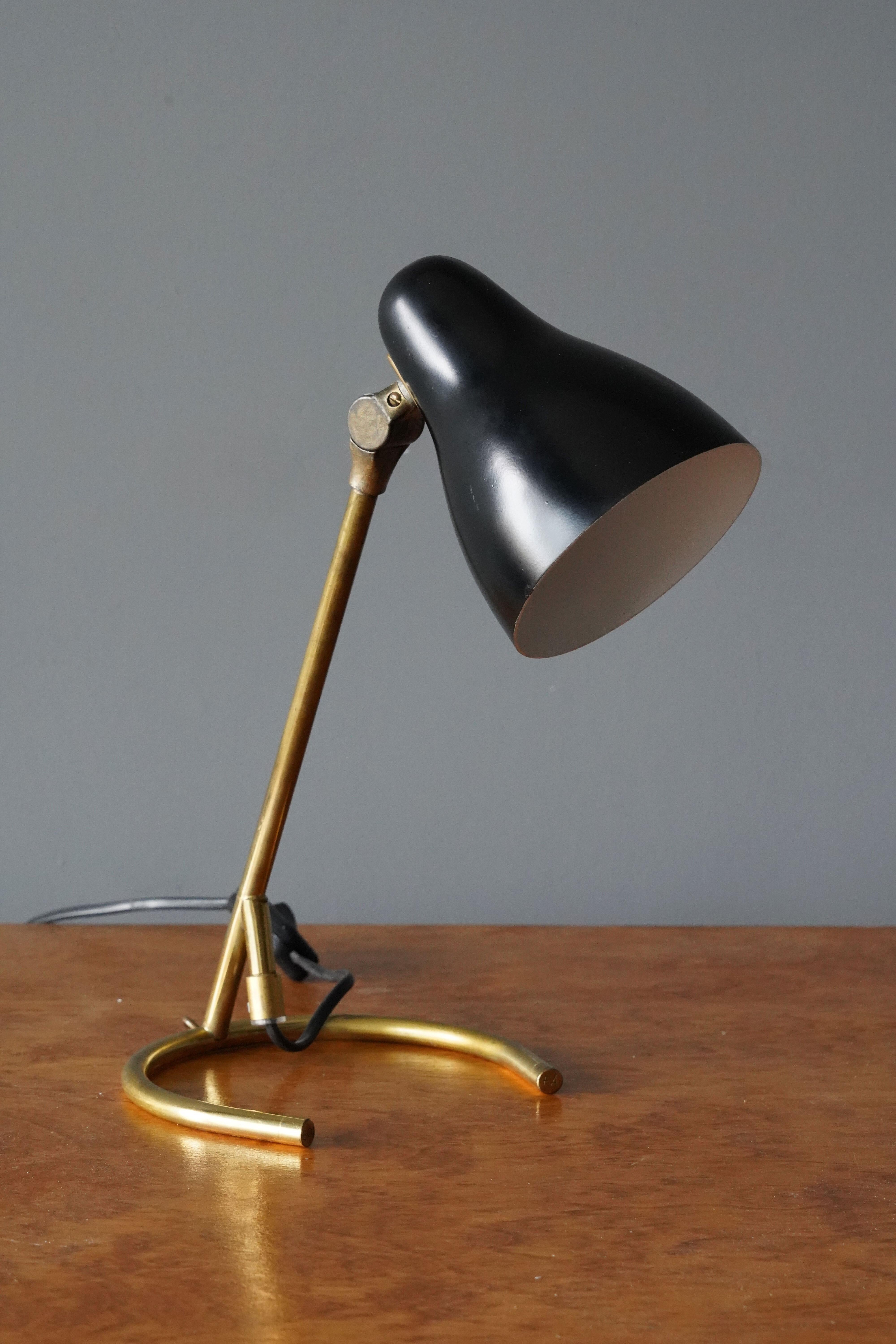 An adjustable table lamp or wall light. Designed and produced Sweden, 1950s. In brass and black-lacquered metal. 

Other designers of the period include Jean Royere, Paolo Buffa, Gino Sarfatti, Hans Bergström, and Paavo Tynell.