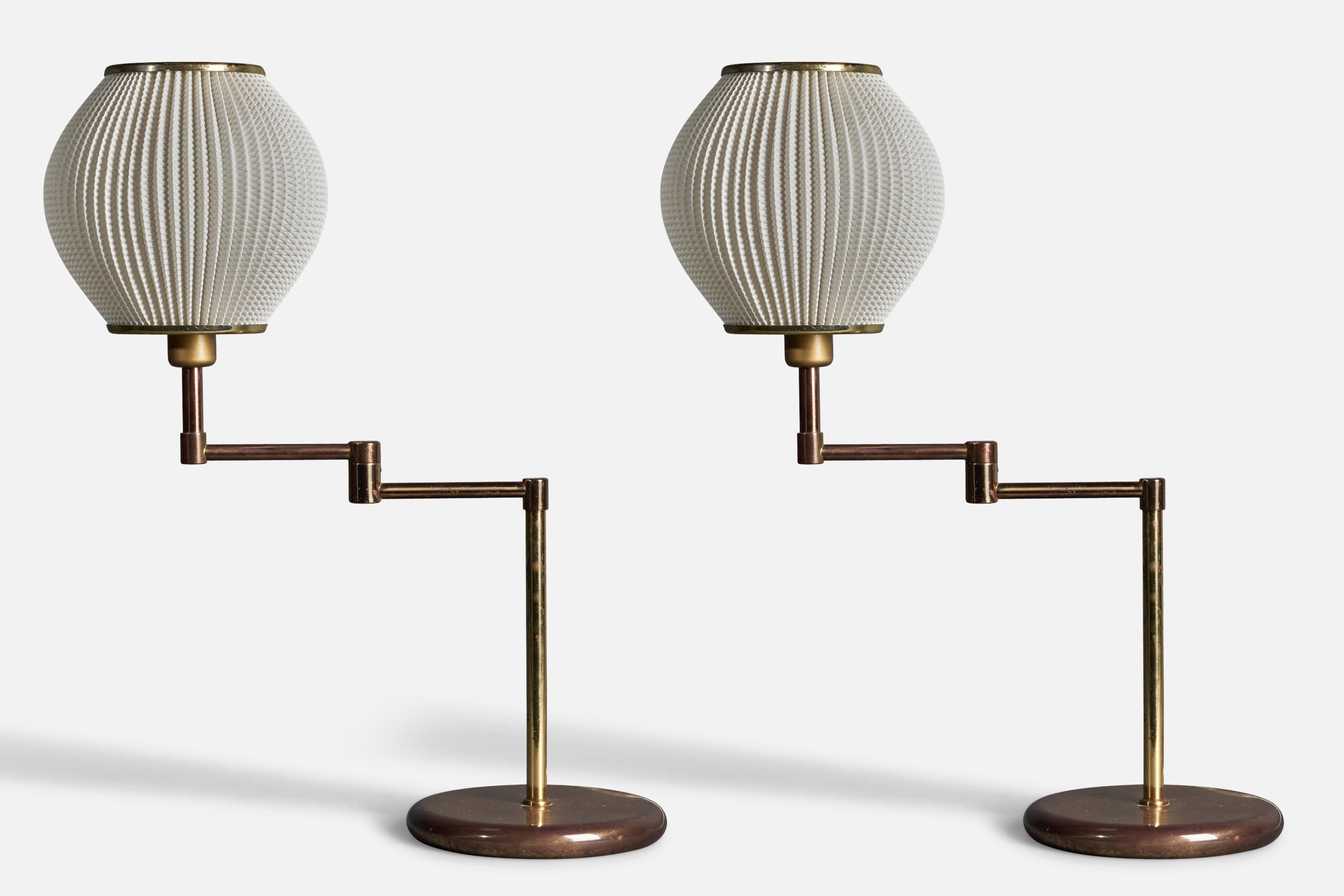 A pair of table lamps, designed and produced in Sweden, c. 1960s-1970s. In brass.

Overall Dimensions (inches): 16.93” H x  9.06