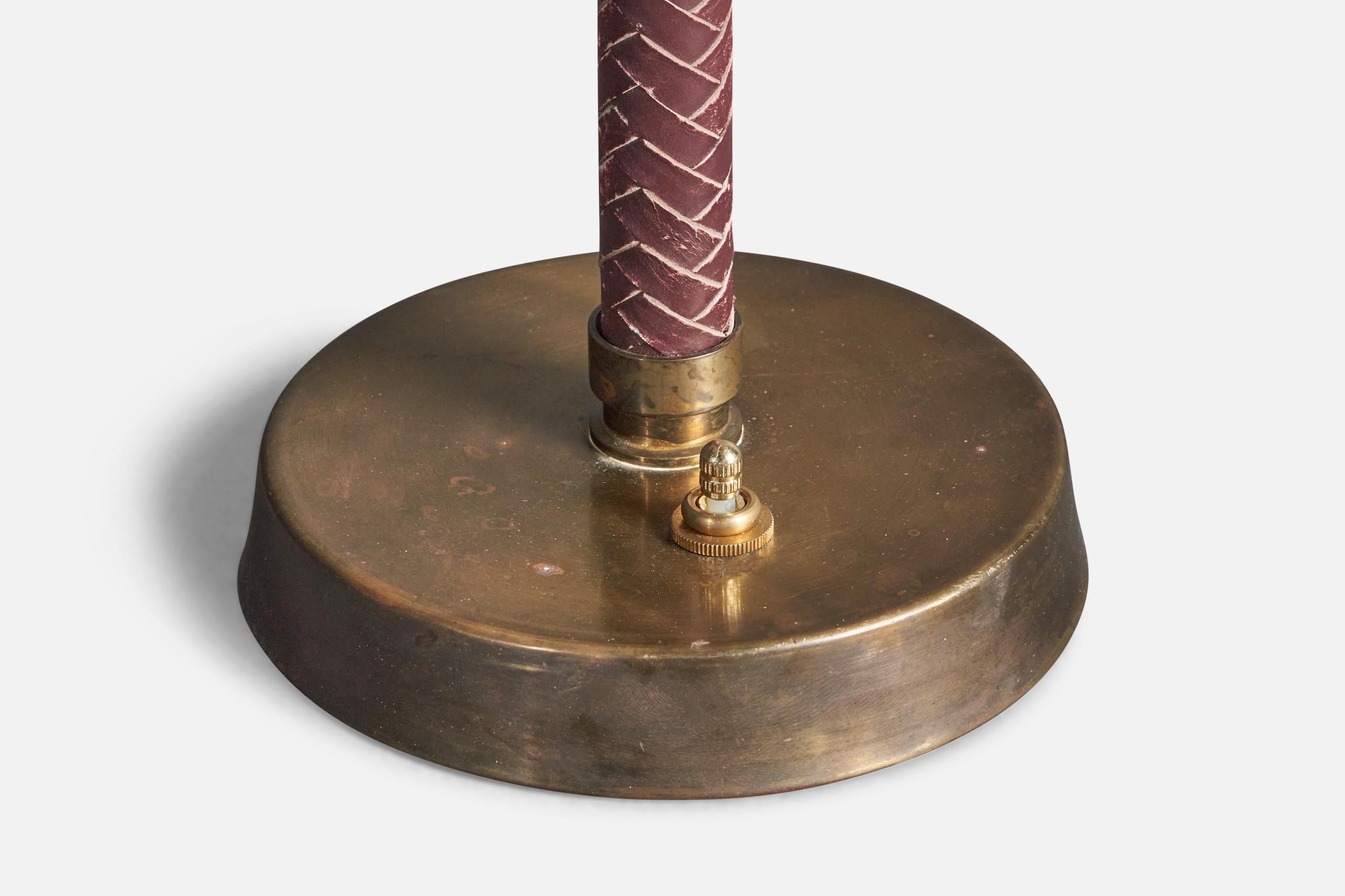 A table lamp. Designed and produced in Sweden, 1940s. Brass with finely braided and dyed leather.

Condition: Good 
Wear consistent with age and use. Original patina consistent with age and use. Losses to leather dye as illustrated.

Dimensions of