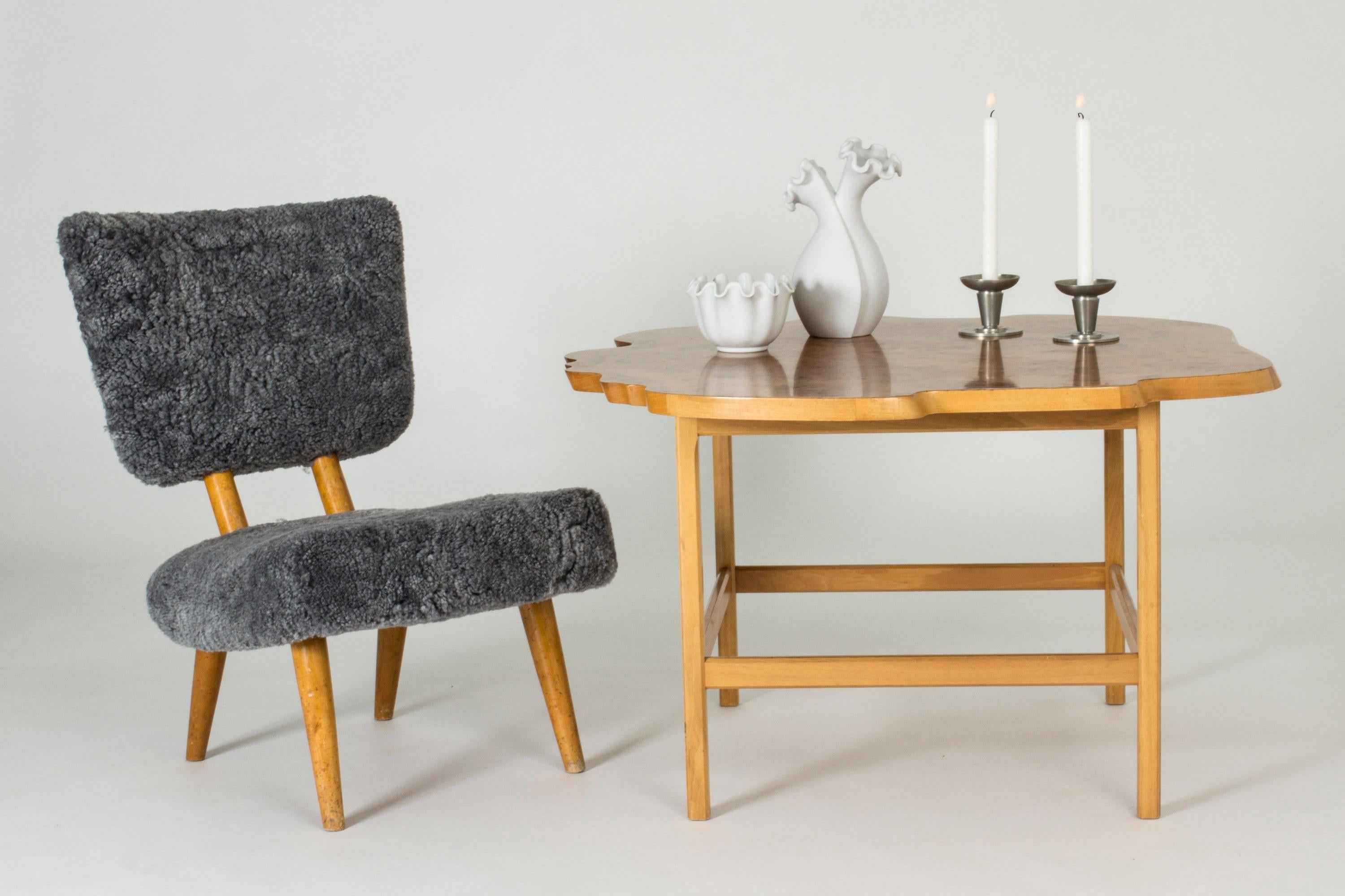 Striking coffee table by Josef Frank with a birch frame and beautiful alder root tabletop. Organic silhouette that imitates the shape of a tree trunk.