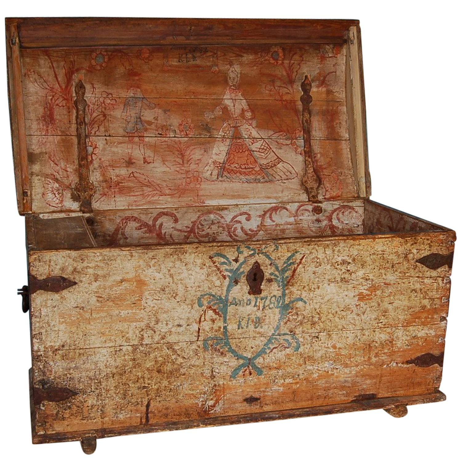 An exceptional Swedish Gustavian dowry chest with original paint on the interior and exterior. The interior painting depicts a marriage scene and the exterior is inscribed and dated Ano 1782 / KLD, origin: Sweden, dated 1782

All original paint and