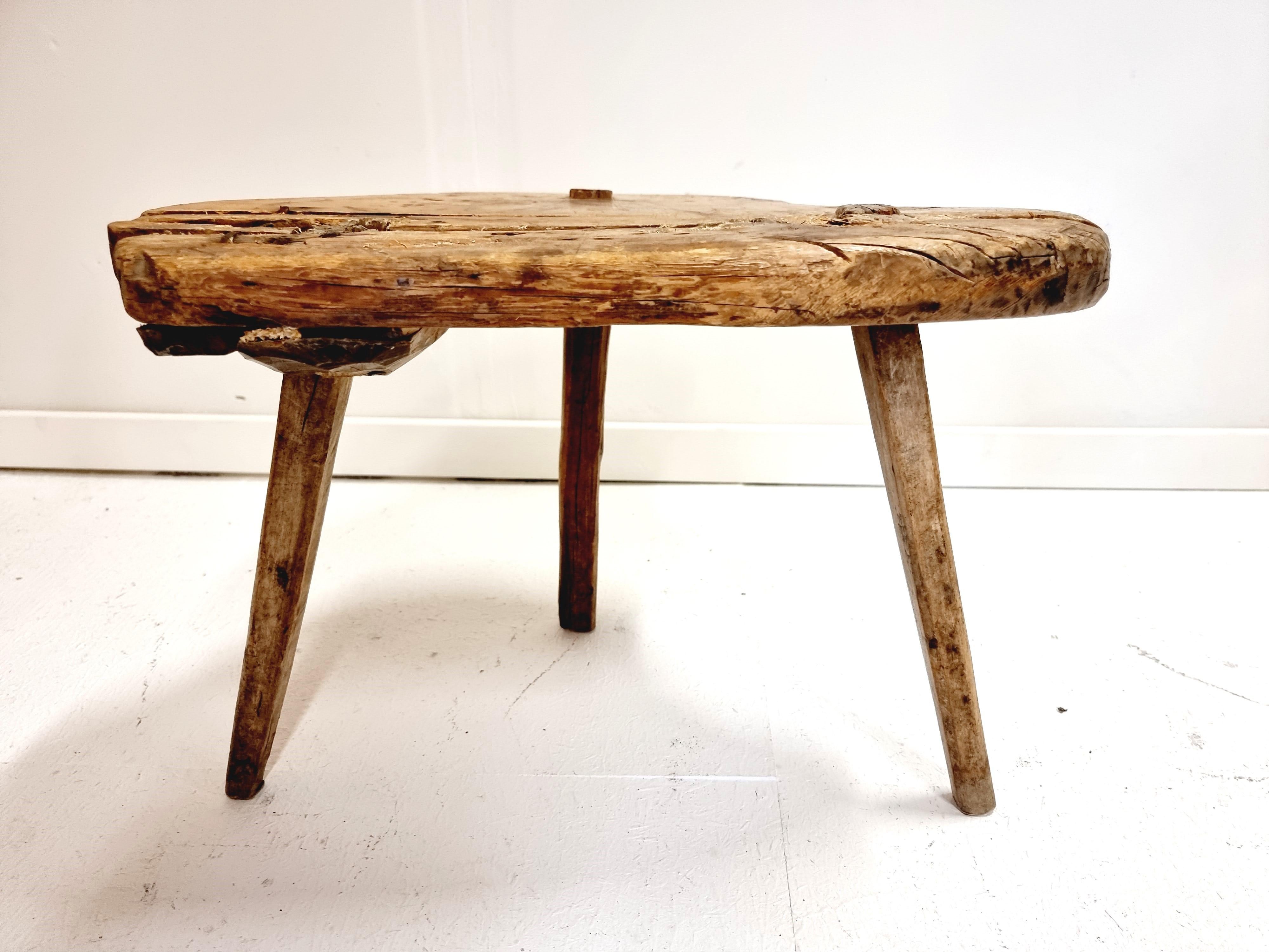 A Swedish Allmoge / Folk Art wooden stool. Seems it has been used for hot pots, round burned pattern on the top. Signed by previous owners underneath top. Sweden, 190th century.

Patina, has been mended a few times during the years. 

 