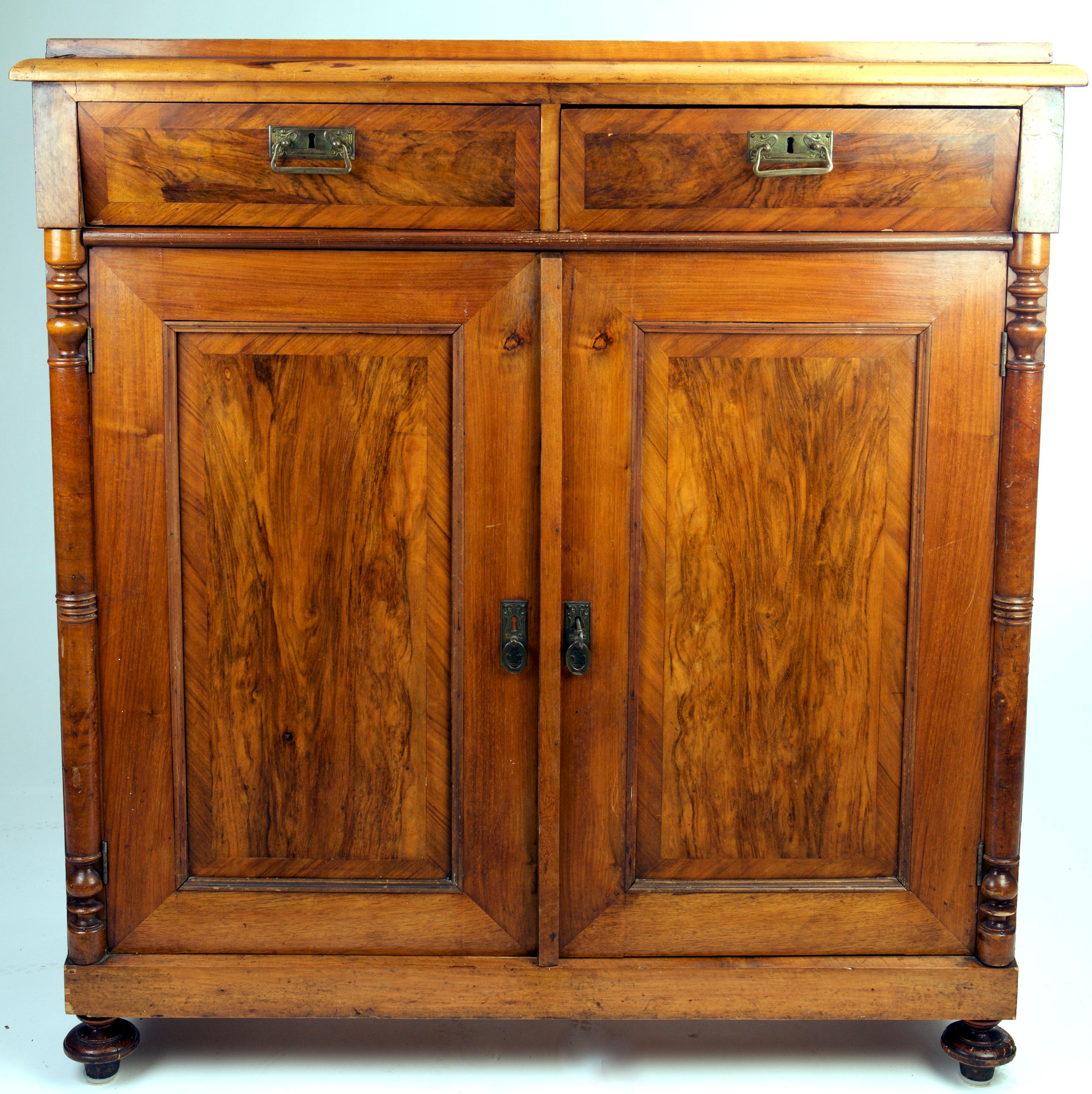 An ornate cupboard in mahogany in a very good condition.