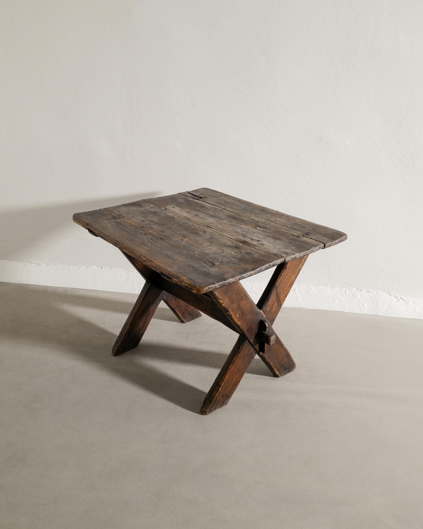 Scandinavian Modern Swedish Antique Dark Wooden Pine Table with Crossed Legs Produced Late, 1800s 