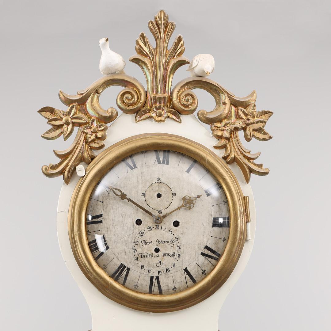 Stunning and rare one of a kind very tall 235cm  C.1830 antique Swedish mora clock with elaborate carved detail on the hood with curlicues and 2 dove figures in a white paint finish and exceptional detailed face in wood which makes it even more