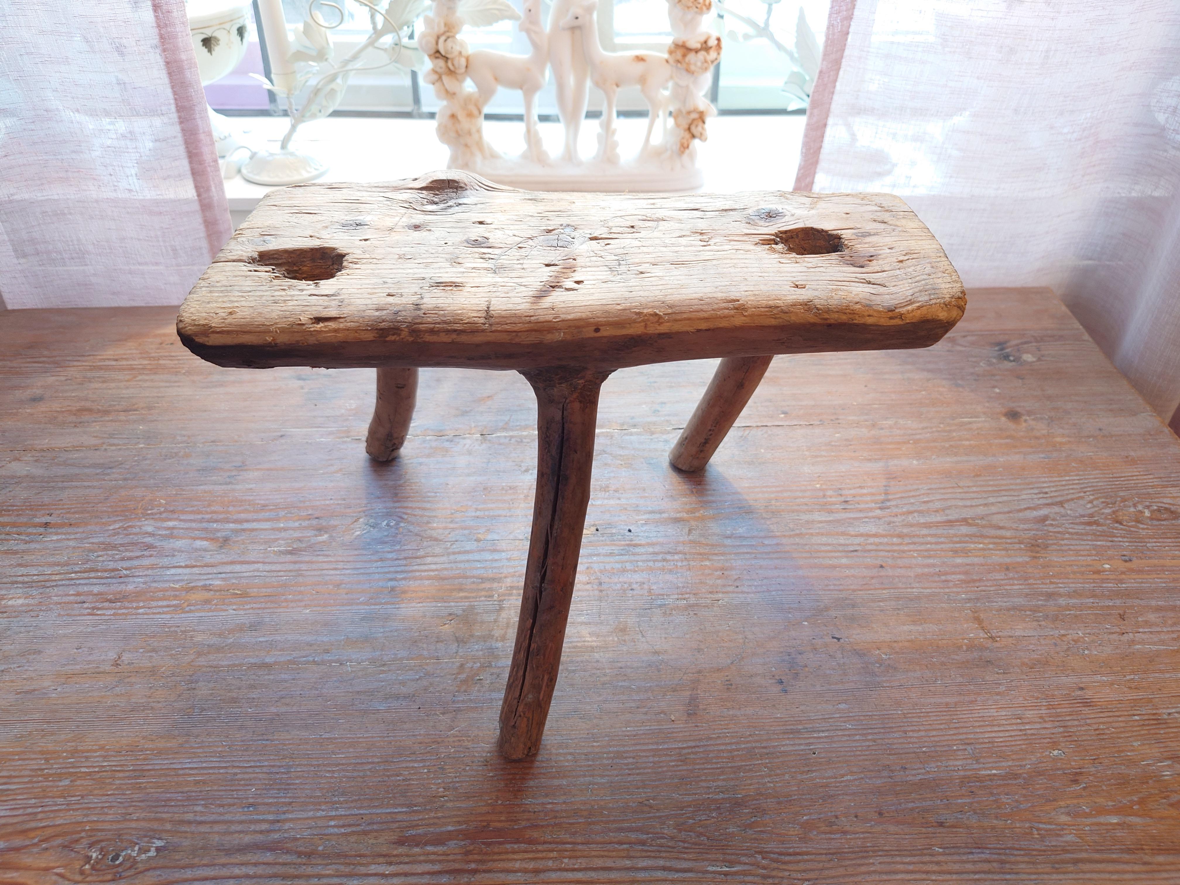 Primitive small Milking Stool, with its rustic charm and weathered appearance, this stool embodies the beauty of imperfection, adding a touch of vintage character and warmth to your home.
Made out of a solid piece of pine wood.



