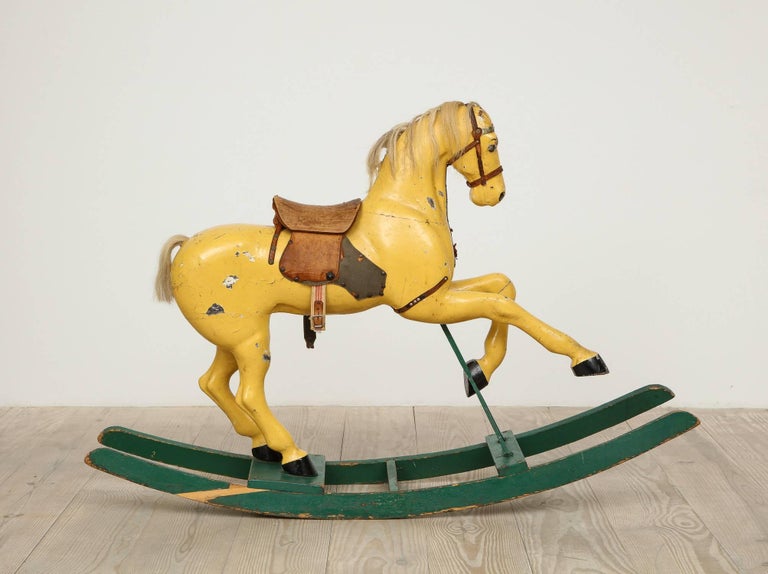 Swedish antique toy rocking horse, origin: Sweden, circa 1870 - 1900.

Beautiful, untouched, original condition including the paint, leather saddle, girth and stirrups. The tail and mane are made of real horse hair.