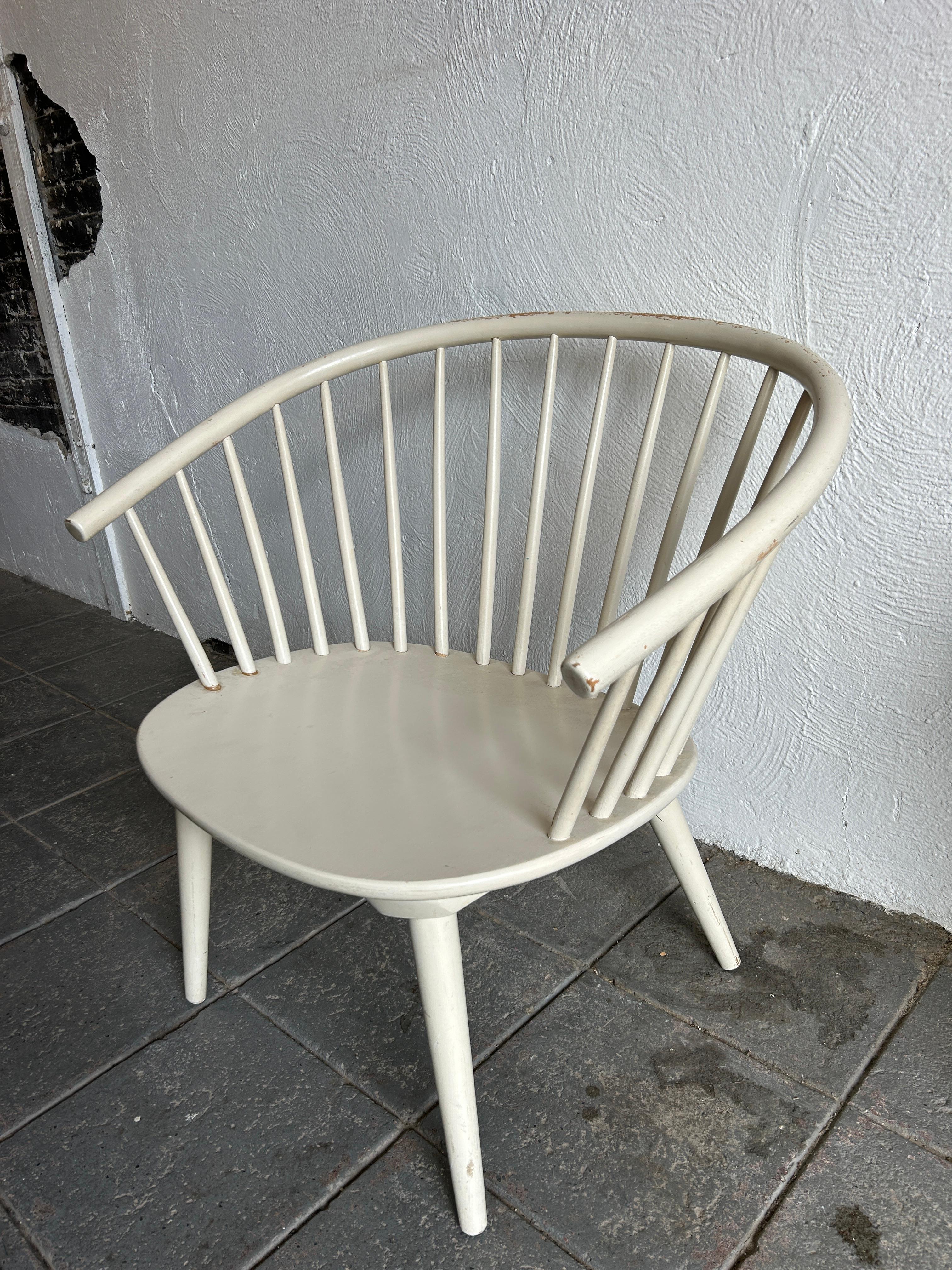 Swedish Armchair by Gillis Lundgren for IKEA, 1961. Original ivory white paint some paint missing on top of back and a few nicks otherwise beautiful of white color. Chair is very structural all legs unscrew. Very wonderful spindle back chair all