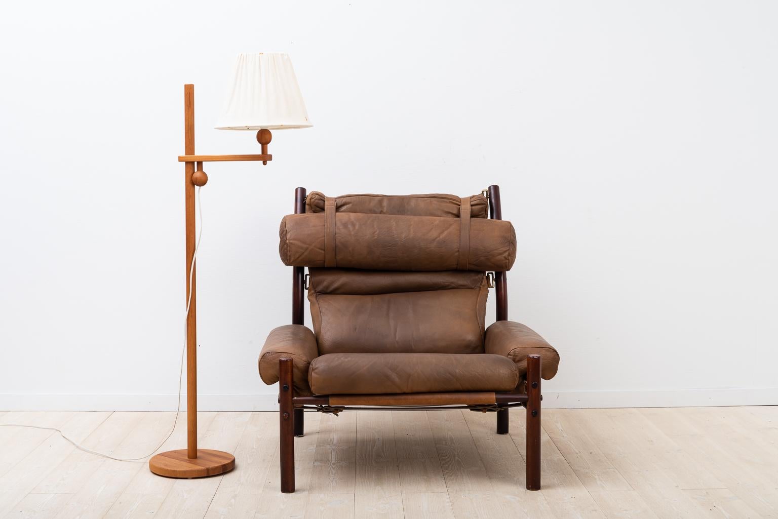 Swedish armchair INCA designed by Arne Norell and manufactured by Norell Möbler. From the 1970s. Wooden frame in stained birch and upholstery in leather. The frame is kept together by strong leather straps, completely free of glue and screws.