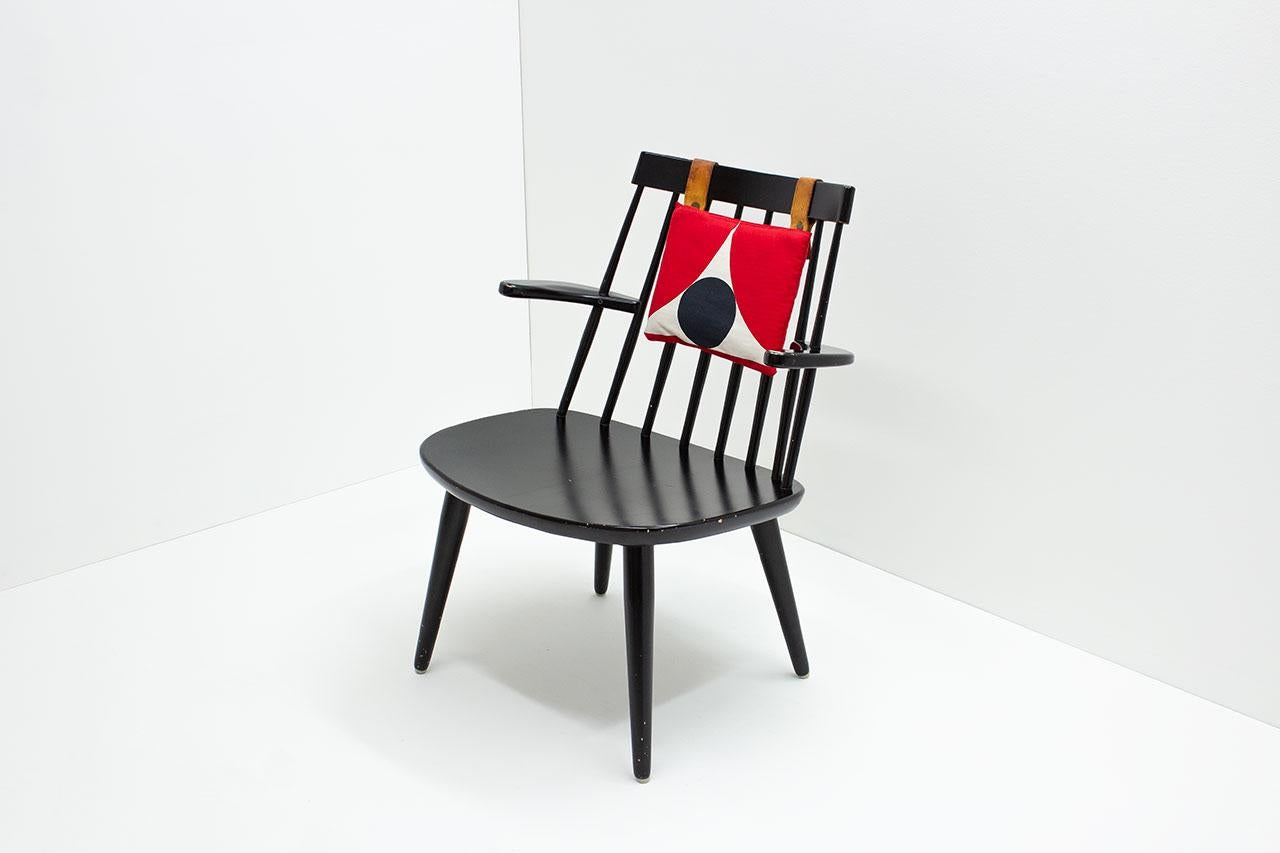 Armchair model  “Sibbo” designed by Yngve Ekström in 1955.  Manufactured
by Stolab in Sweden (circa 1970). Original black painted wood frame with small original backrest cushion later upholstered in a “Marimekko” style fabric.