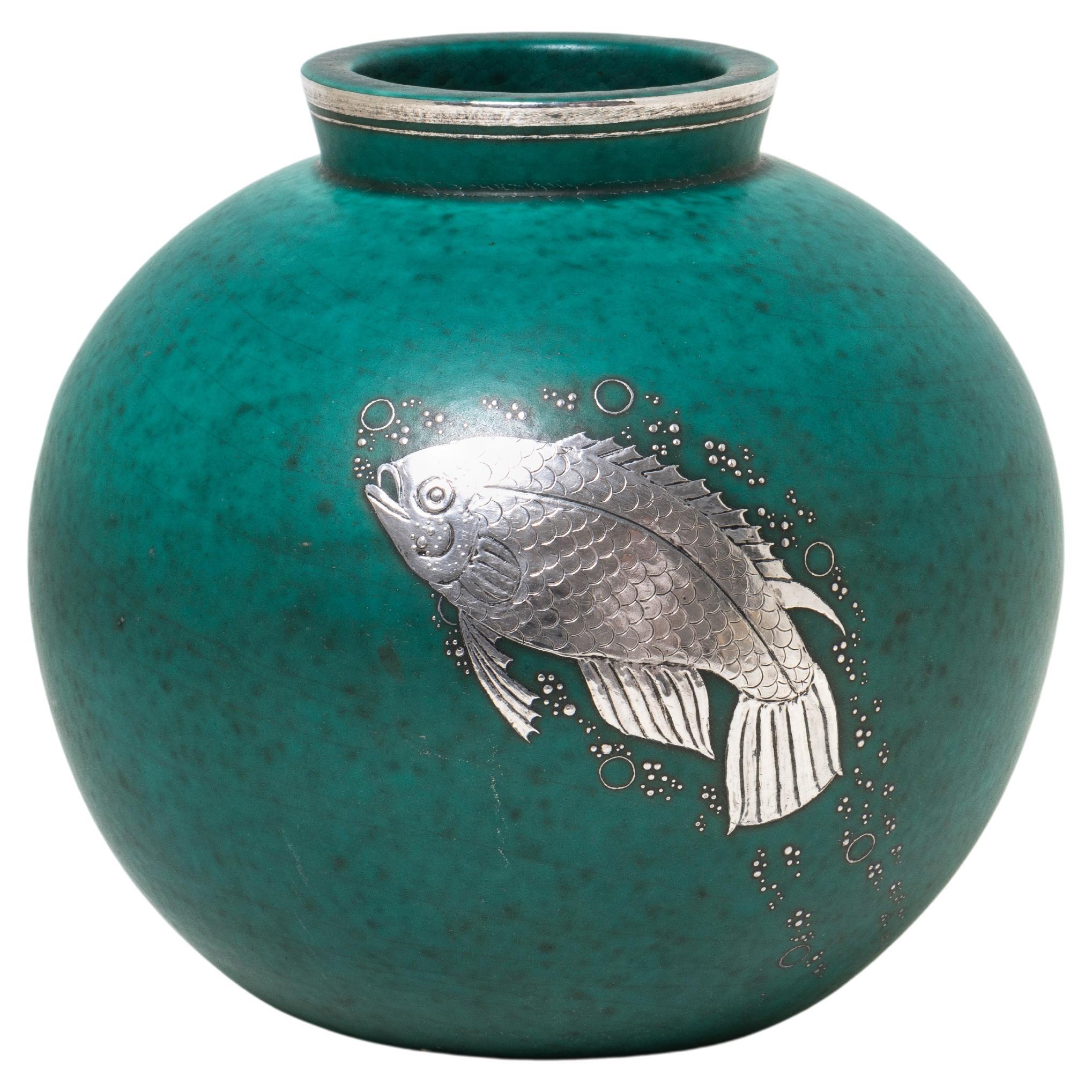 Wilhelm Kåge (1889-1960) is one of the most well-known representatives of the illustrious Swedish ceramic design of the 20th century. This piece is stamped 