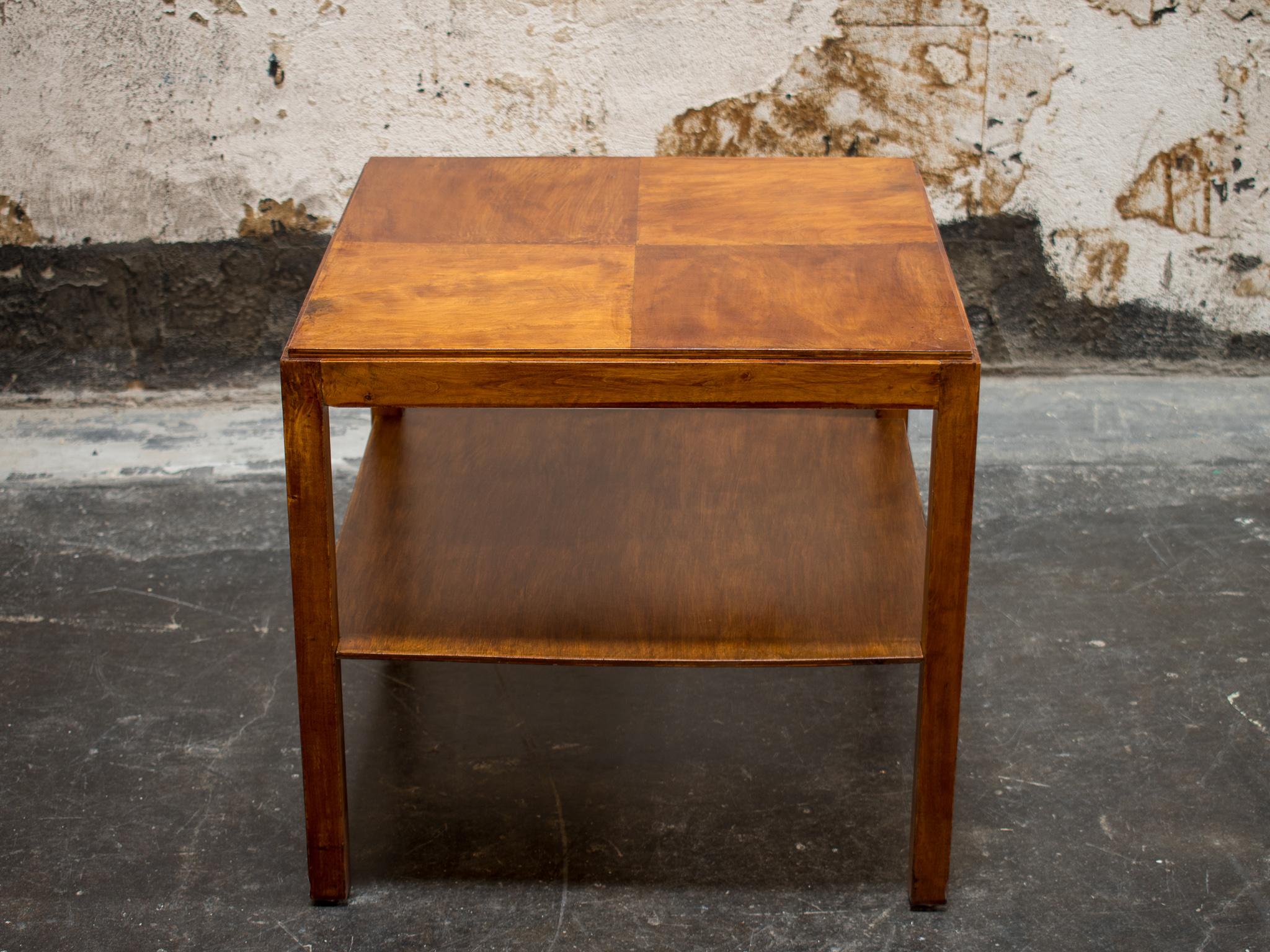 Swedish Art Deco Birch coffee or side table with parquetry top and lower shelf. This piece features a unique grain and finish that give the appearance of brush strokes.