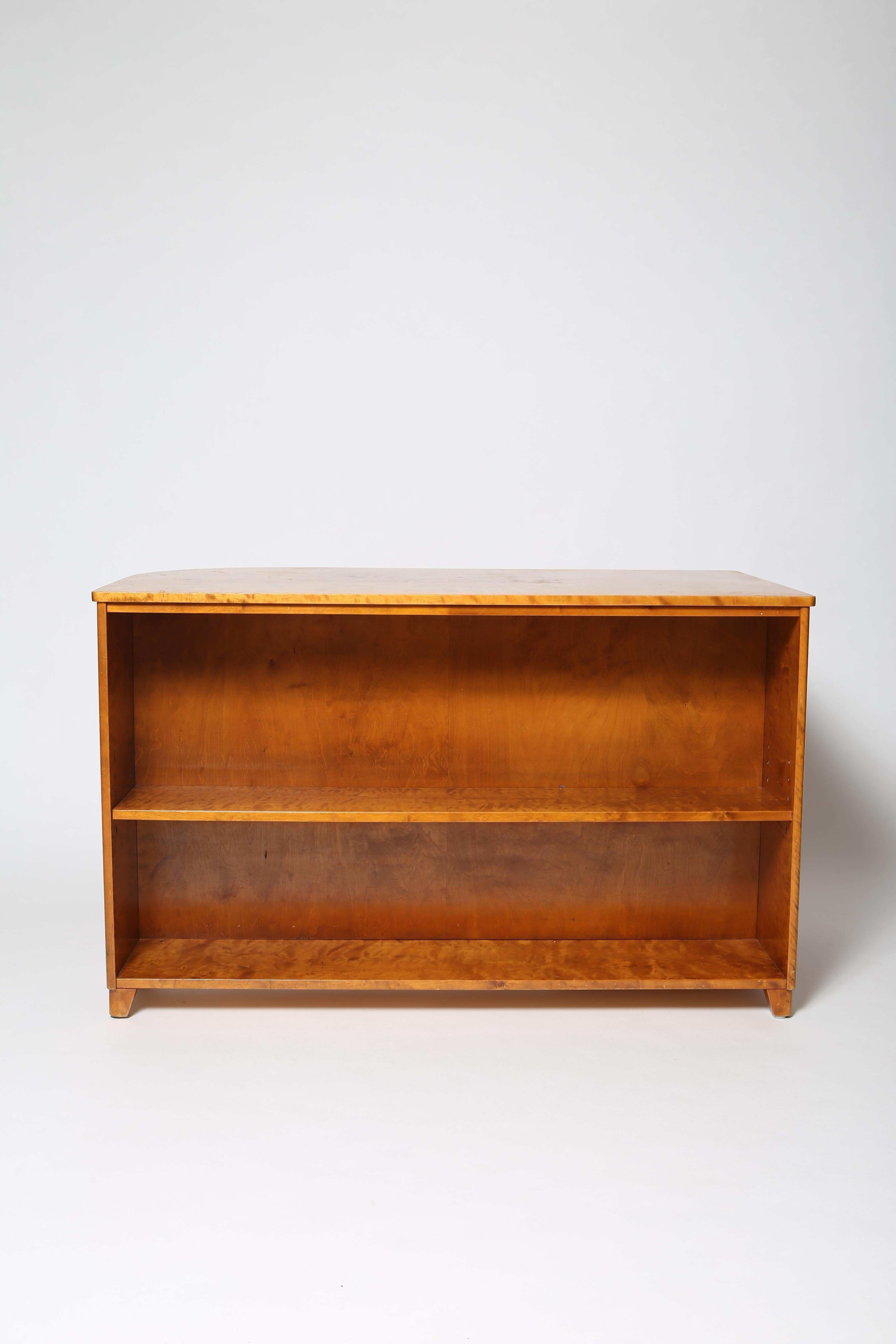 Charming bird’s eye birch veneer over solid beech wood writing desk with exterior bookcase and cabinet at left. In the style of Axel Einar Hjorth or Carl Malmsten, this desk is stamps with the Swedish furniture makers guild mark to interior. The