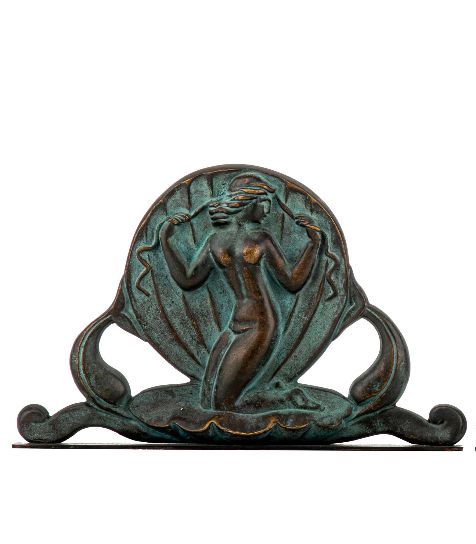 Swedish Art Deco bookends in bronze by Oscar Andersson for Ystad Metall. Bookends cast in Bronze. Made in Sweden, 1920s. The Birth of the nude Venus in a giant scallop shell. Both stamped O. A. (Oscar Andersson) and Ystad Metall.