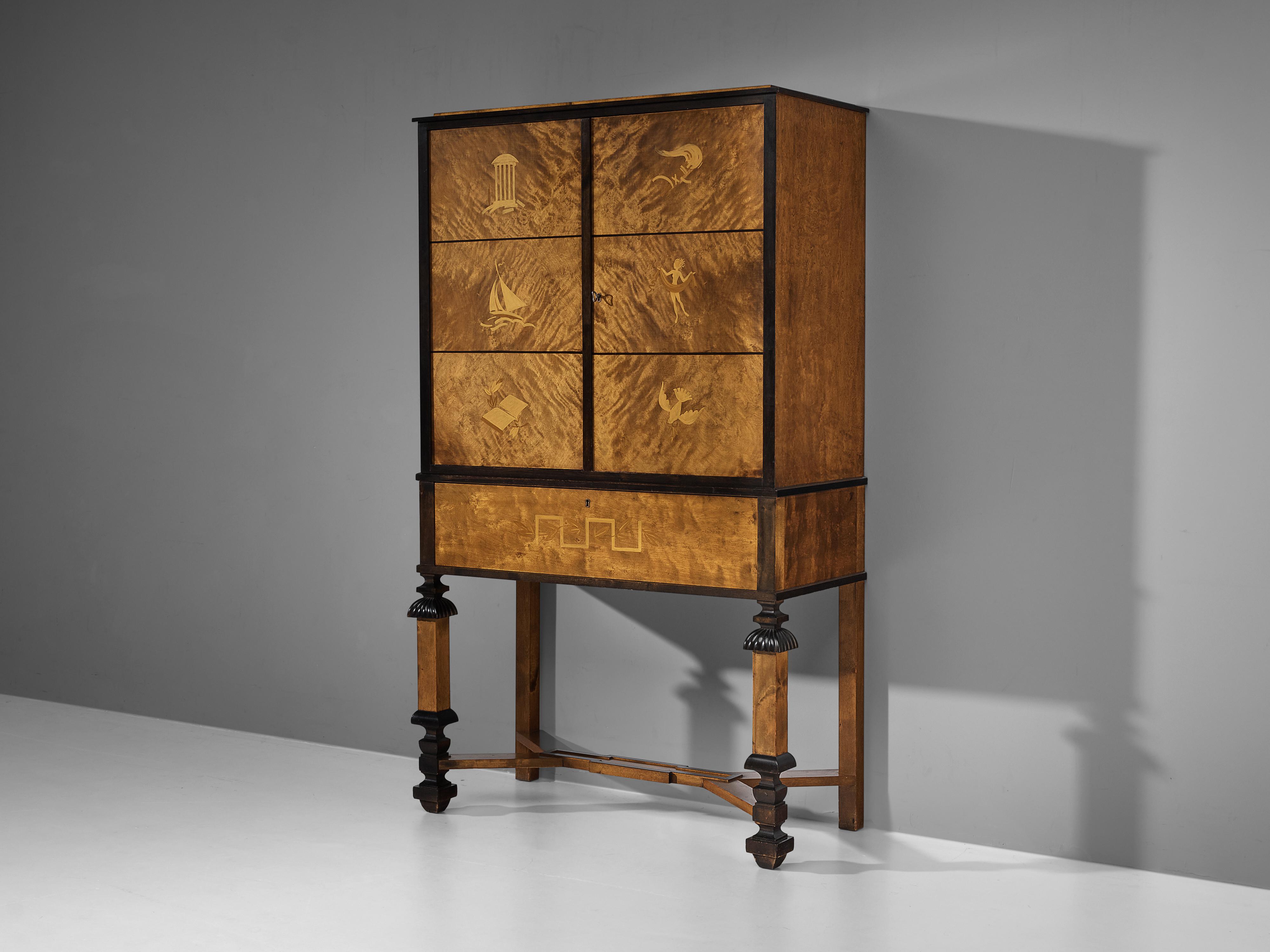 Cabinet, birch, brass, Sweden, 1920s

Excellent Swedish cabinet in the so-called Swedish Grace style. The elegantly structured cabinet in curly birch has two front doors above a drawer. The doors are visually divided in three fields each. An