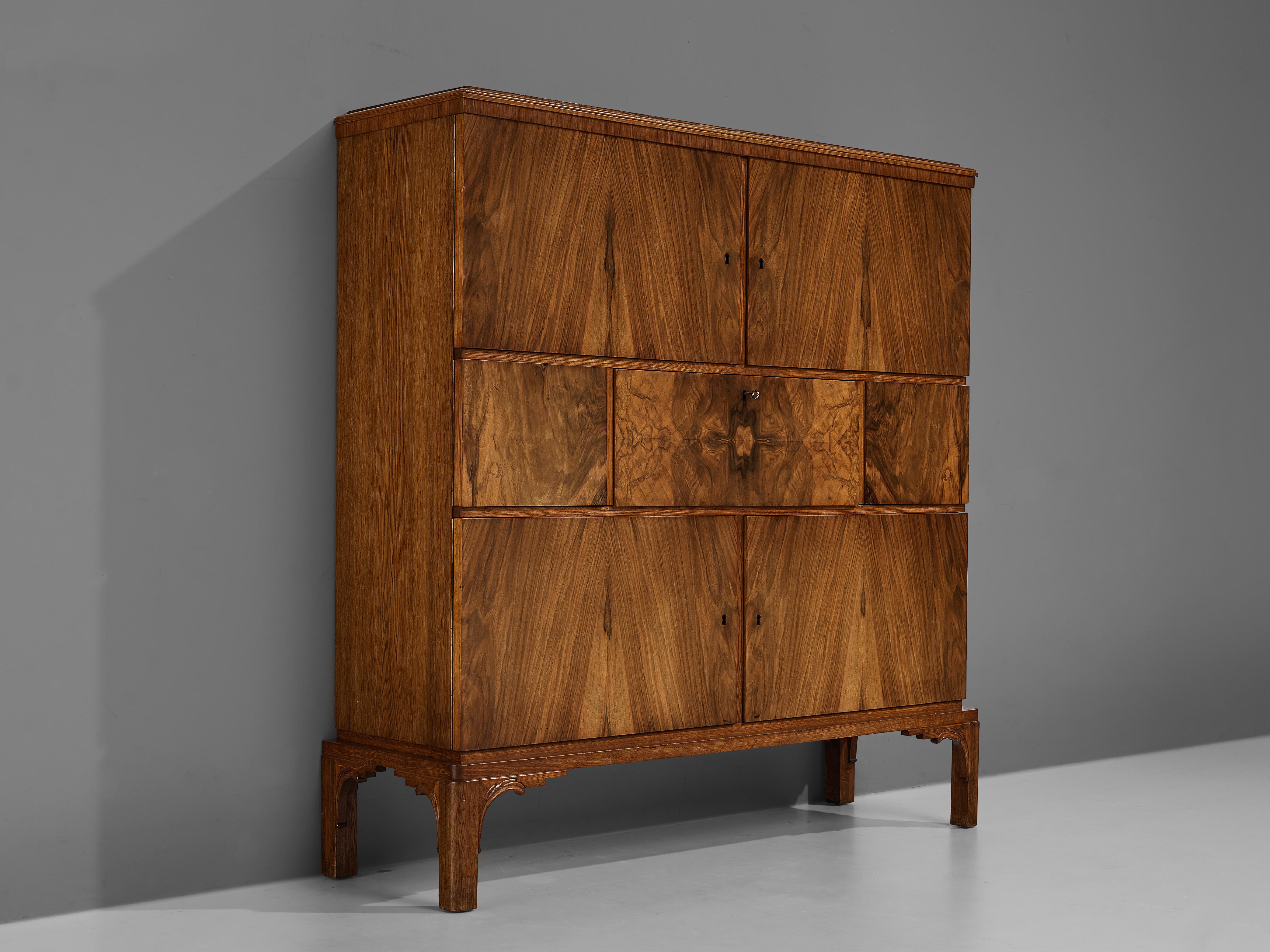 Cabinet, walnut veneer, oak, bakelite, metal, Sweden, 1930s

Swedish Grace cabinet with secretaire in walnut veneer and oak. The high-quality piece satisfied with a design that could not be more pleasing for the viewer’s eye. Veneered walnut with an