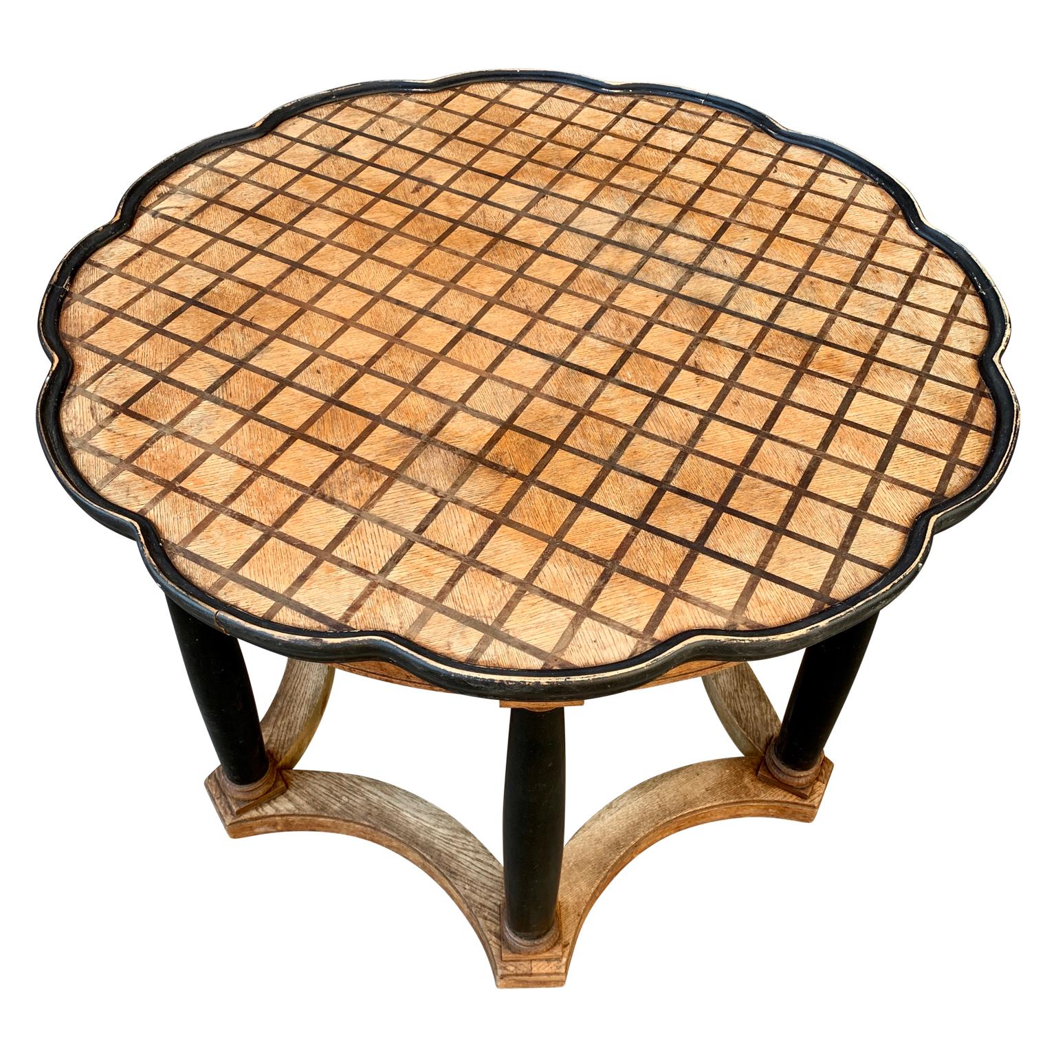 Scandinavian Art Deco cocktail table in both dark and light intarsia inlay of oak wood. Intarsia woods are fields of different colors and materials which appear to be inlaid in one another, fitting together like a jigsaw puzzle. The black painted