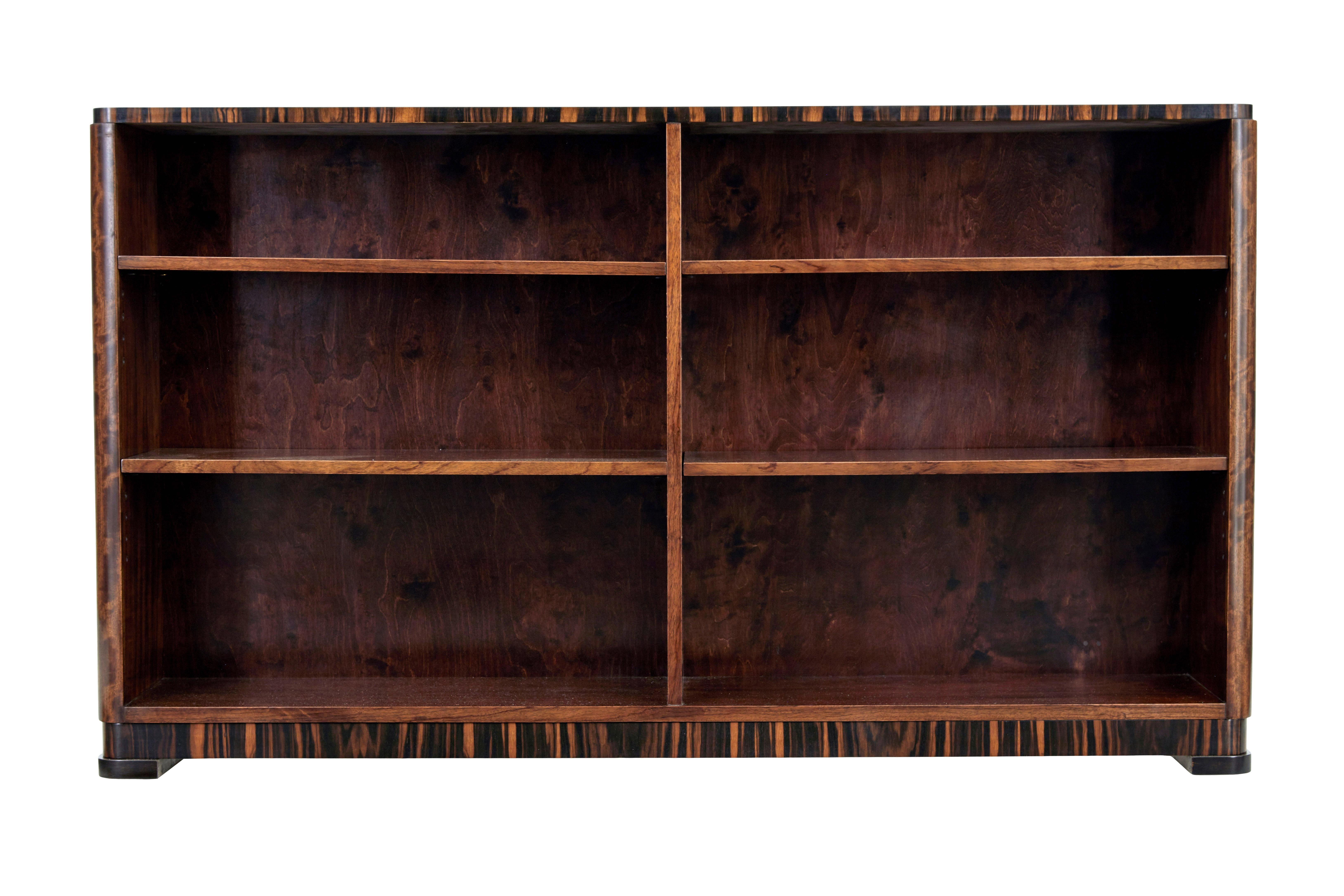 Swedish Art Deco dark birch open bookcase, circa 1930.

Beautiful open bookcase made to a high standard. Rectangular shape made in birch which has been stained the colour of walnut. Top edge with walnut cross-banding around the top edge.

Main