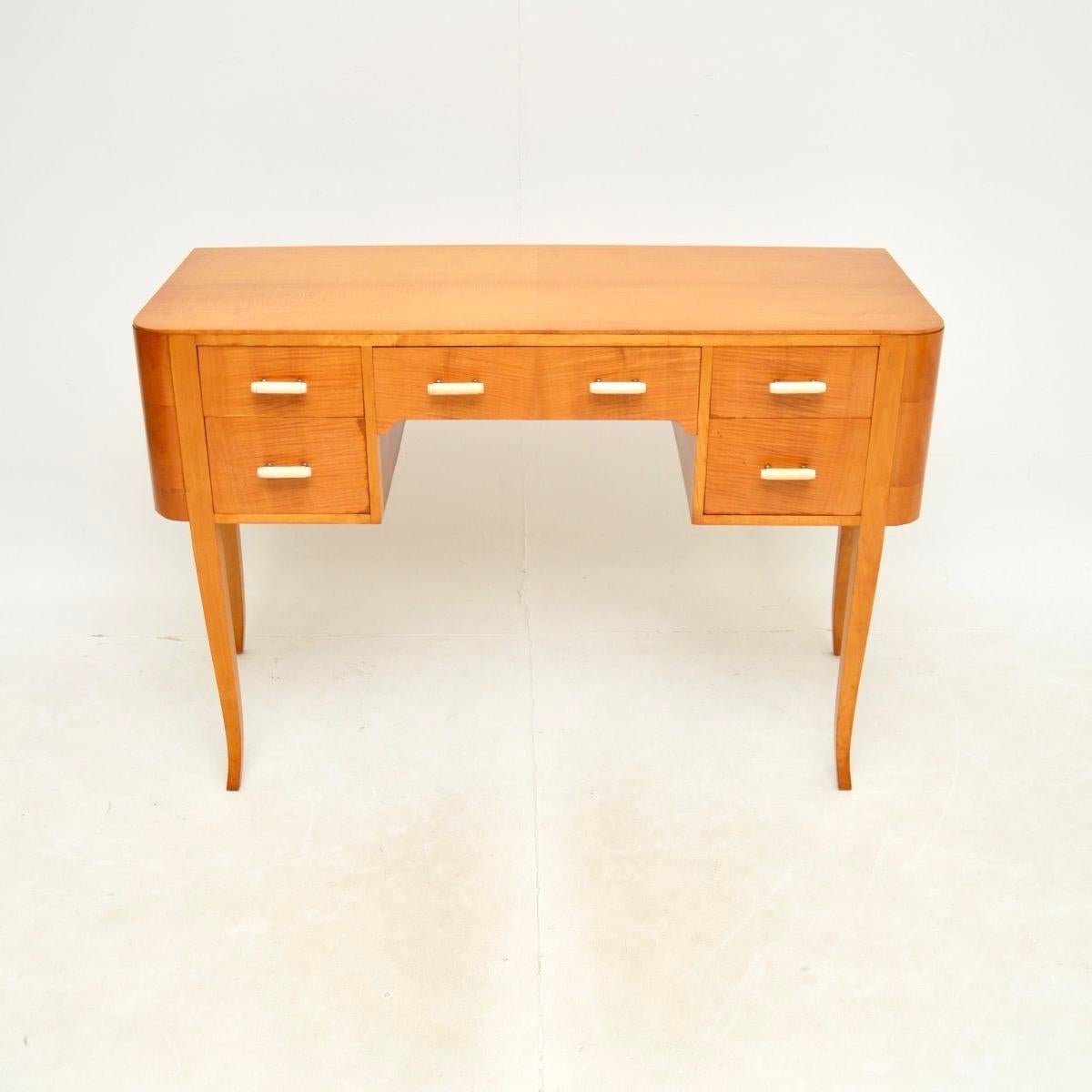 A beautifully made and very stylish Swedish Art Deco desk in satin birch, dating from the 1930’s.

This is of superb quality with an elegant design, it is a very useful size. It is wide and has a generous knee hole space, it is not too deep from