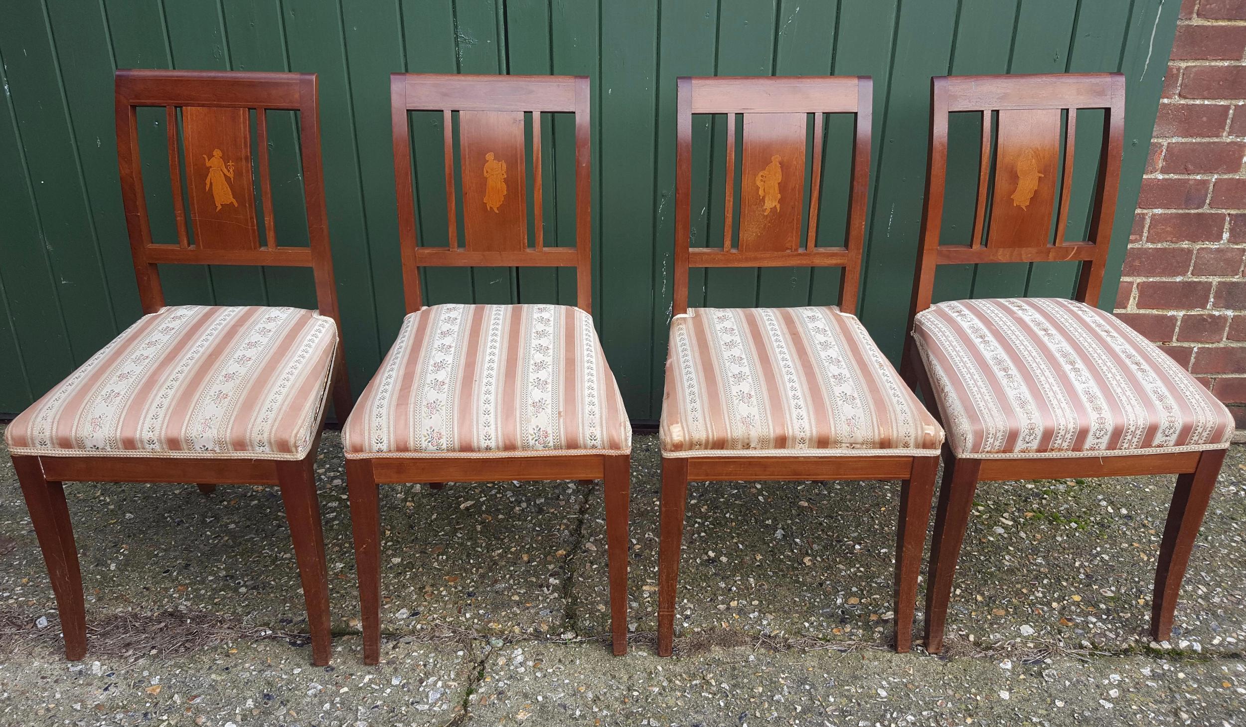 Set of 6 antique Swedish flame golden birch Art Deco dining chairs with the distinctive inlaid seat backs with beautiful detailed marquetry figures of woman.

The top grade flame veneers are brought to life by the sought after darker honey color