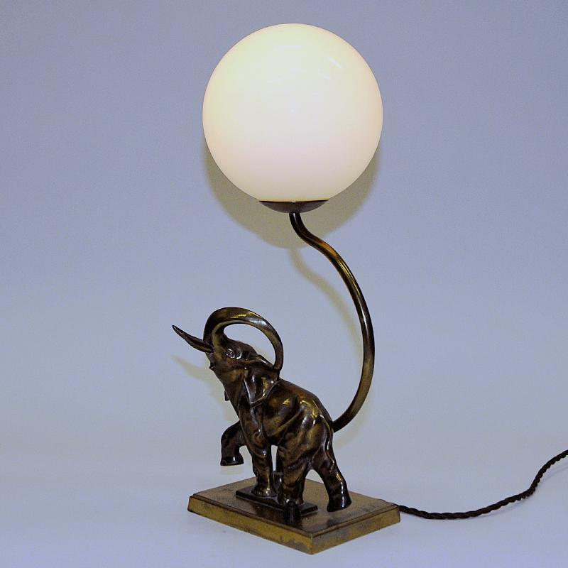 Polished Swedish Art Deco Elephant table lamp with opaline glass shade 1930s
