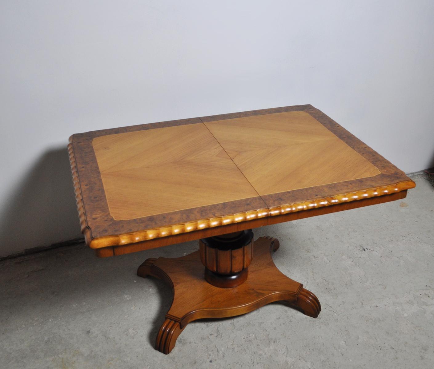 Swedish Art Deco rectangular golden elm end or side table with a detailed pedestal base. Beautifully detailed border on the top and carved edge detail. 
The height is adjustable from 60,5 cm easily swivels up to 73,5 cm high. Originally, it had an