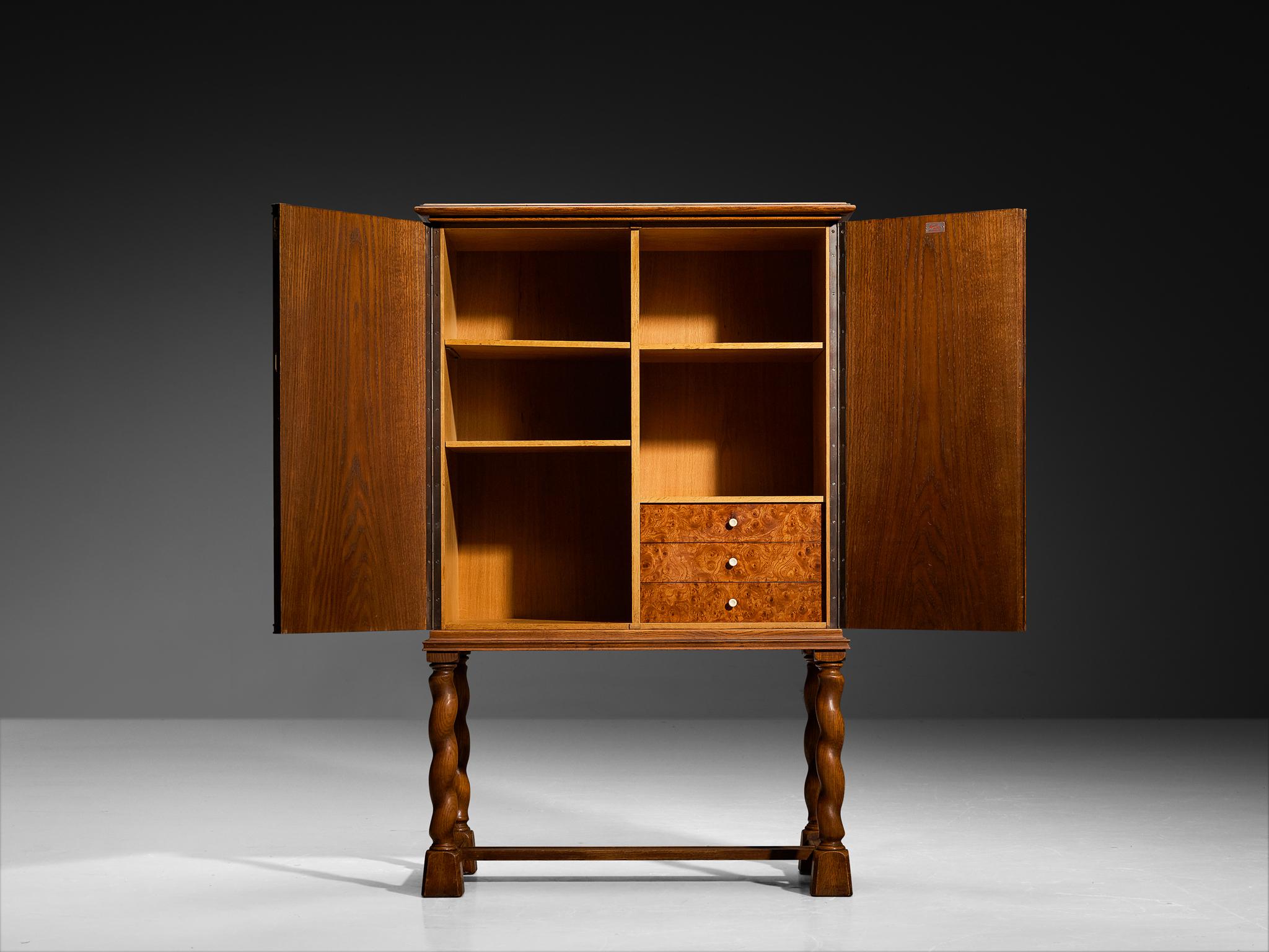 Mid-20th Century Swedish Art Deco High-Legged Cabinet with Carved Doors in Oak For Sale
