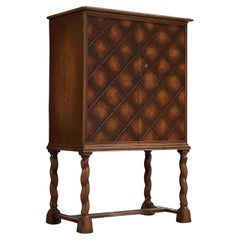 Swedish Art Deco High-Legged Cabinet with Carved Doors in Oak
