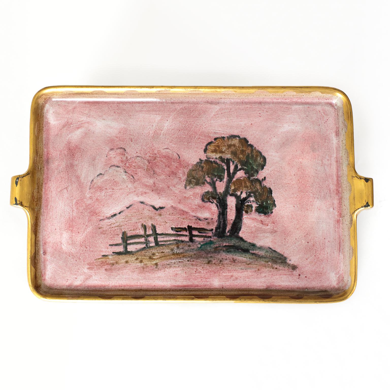 Swedish Art Deco, Scandinavian Modern luster glazed ceramic tray by Josef Ekberg for Gustavsberg features a landscape on a field of pink, detailed in gold. Signed and dated.

Measures: Diameter 18