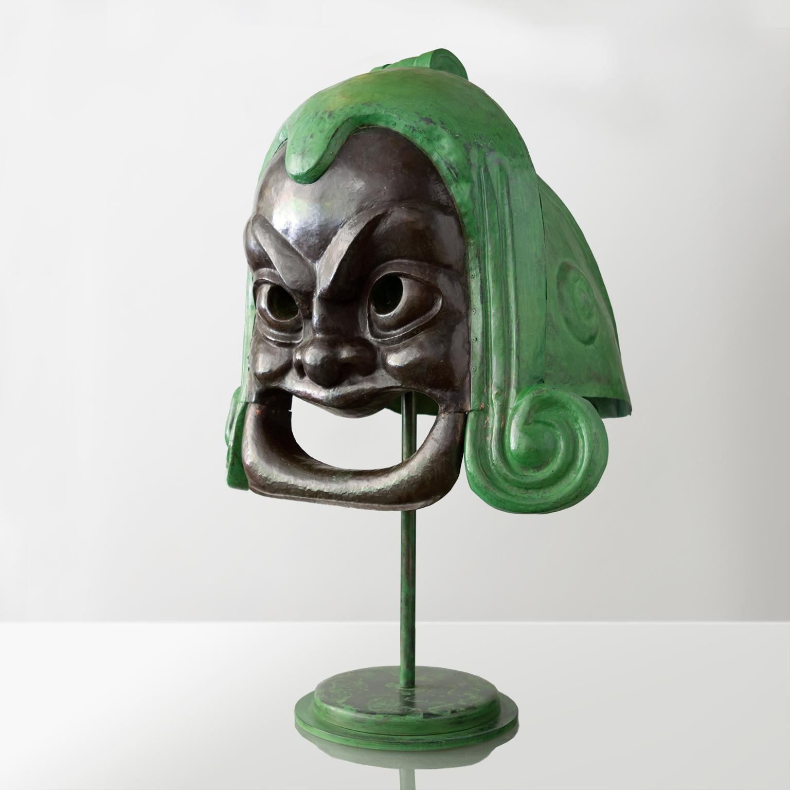 A large exterior sculpture from the circa 1918 Palladium theatre in Stockholm, Sweden. Made completely of copper this “comedy” face is enclosed in a stylized Greek Chalcidian helmet. Newly restored the sculpture now sits on a custom iron stand which