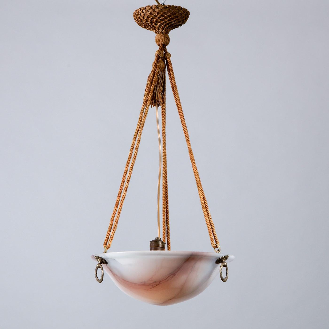 Swedish Art Deco alabaster and brass pendant lamp, Sweden, 1930s. 

Originating from early 20th-century Sweden, this sleek pendant ceiling lamp combines Art Deco design with Swedish craftsmanship for a truly unique piece. This lamp is made of warm,