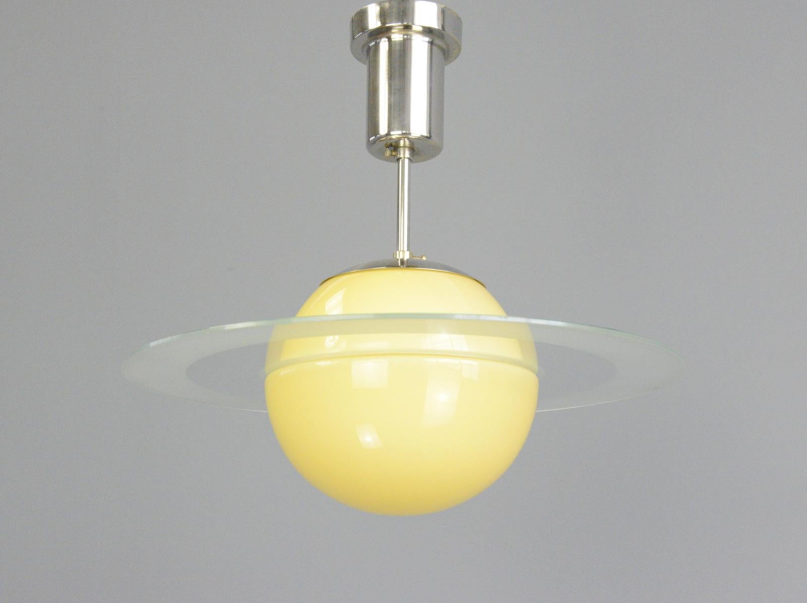 Swedish Art Deco Saturnus light Circa 1930s.

- Yellow glass globes with glass ring
- Original nickel top and ceiling rose
- Takes E27 fitting bulbs
- Swedish ~ 1930s
- 40cm wide x 38cm tall inc ceiling rose

Condition Report

Fully re